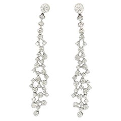 Boucles d'oreilles pendantes en or blanc 18K avec diamants