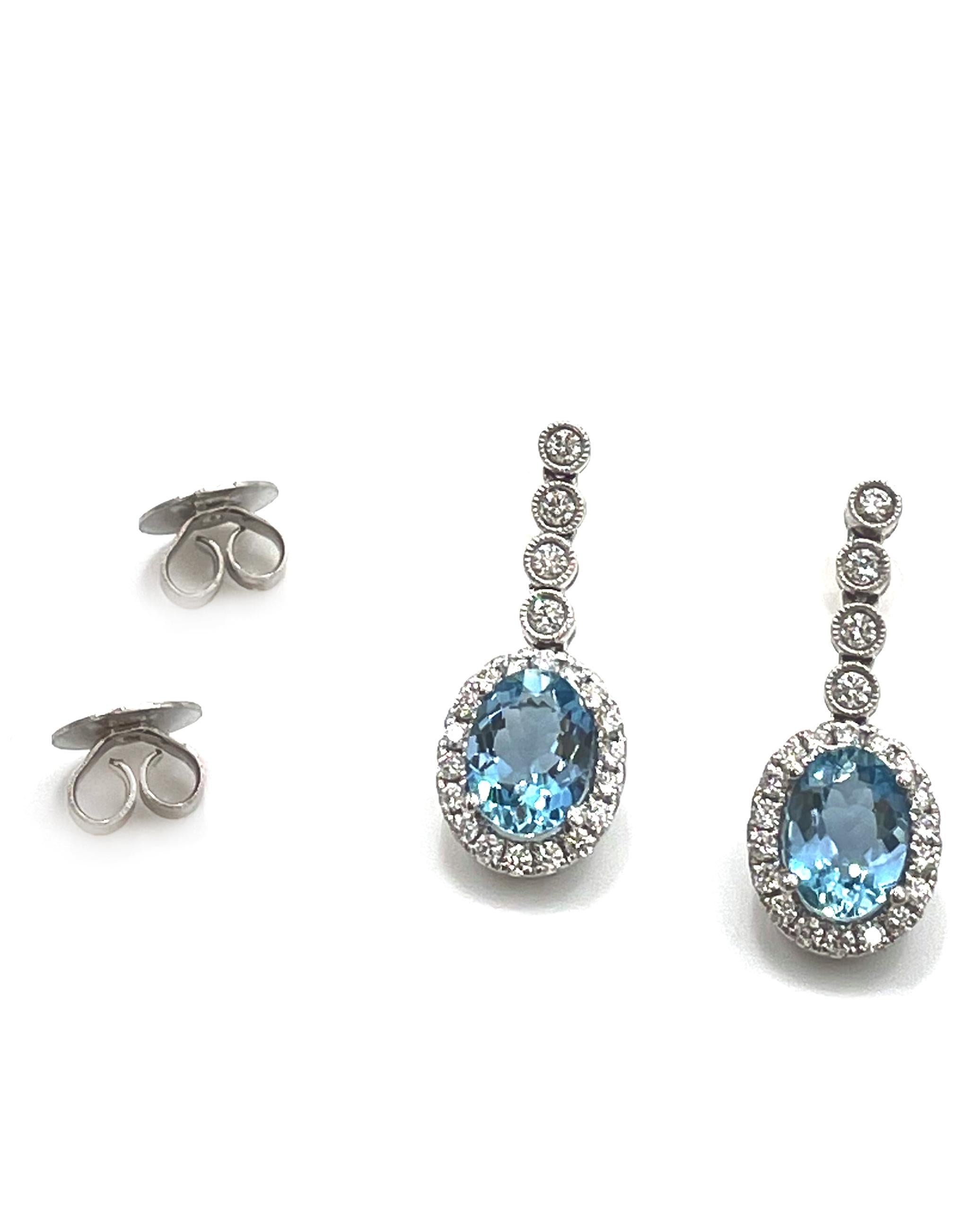 Contemporary 18K White Gold Drop Halo Earrings with Aquamarines and Diamonds For Sale