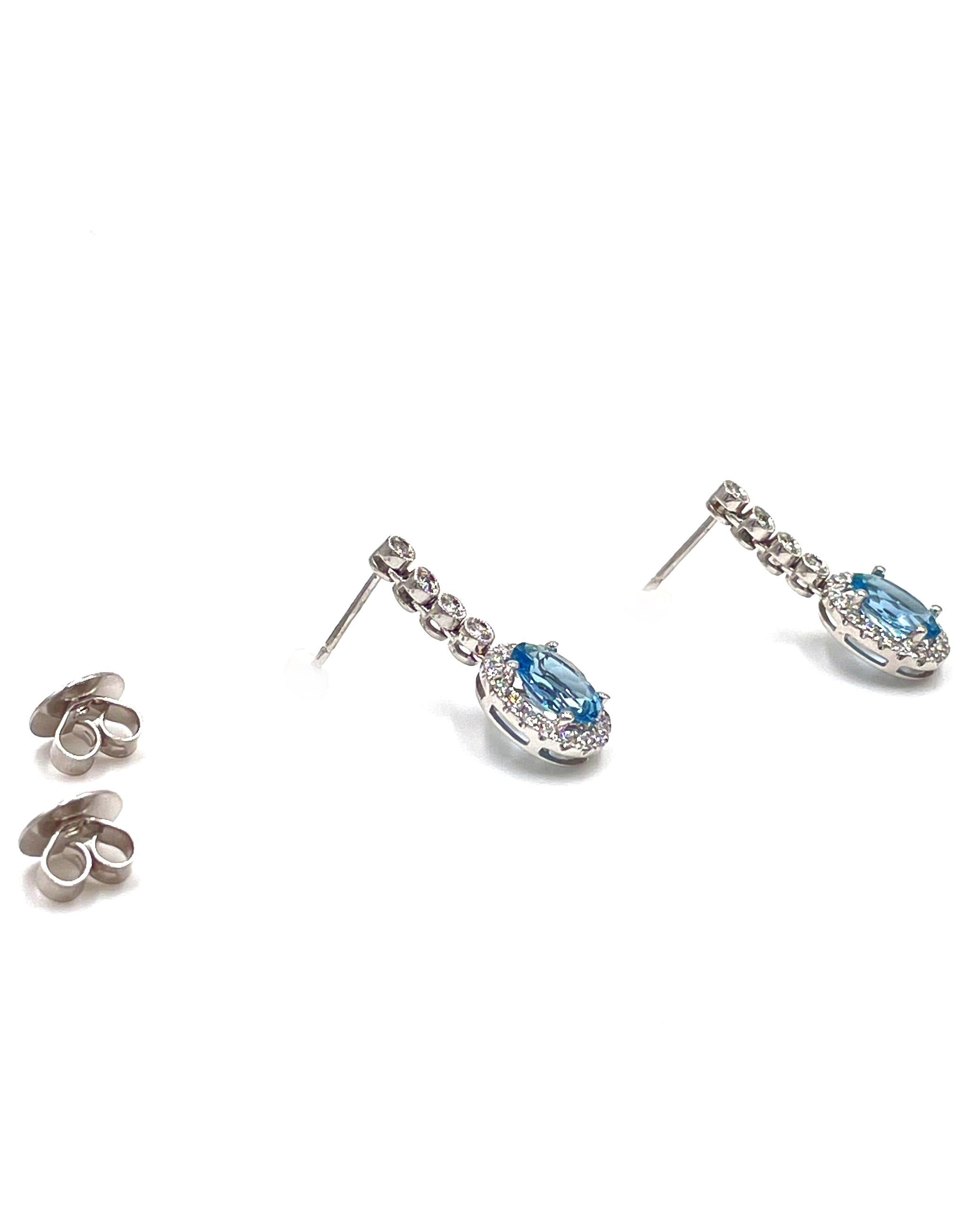 Oval Cut 18K White Gold Drop Halo Earrings with Aquamarines and Diamonds For Sale