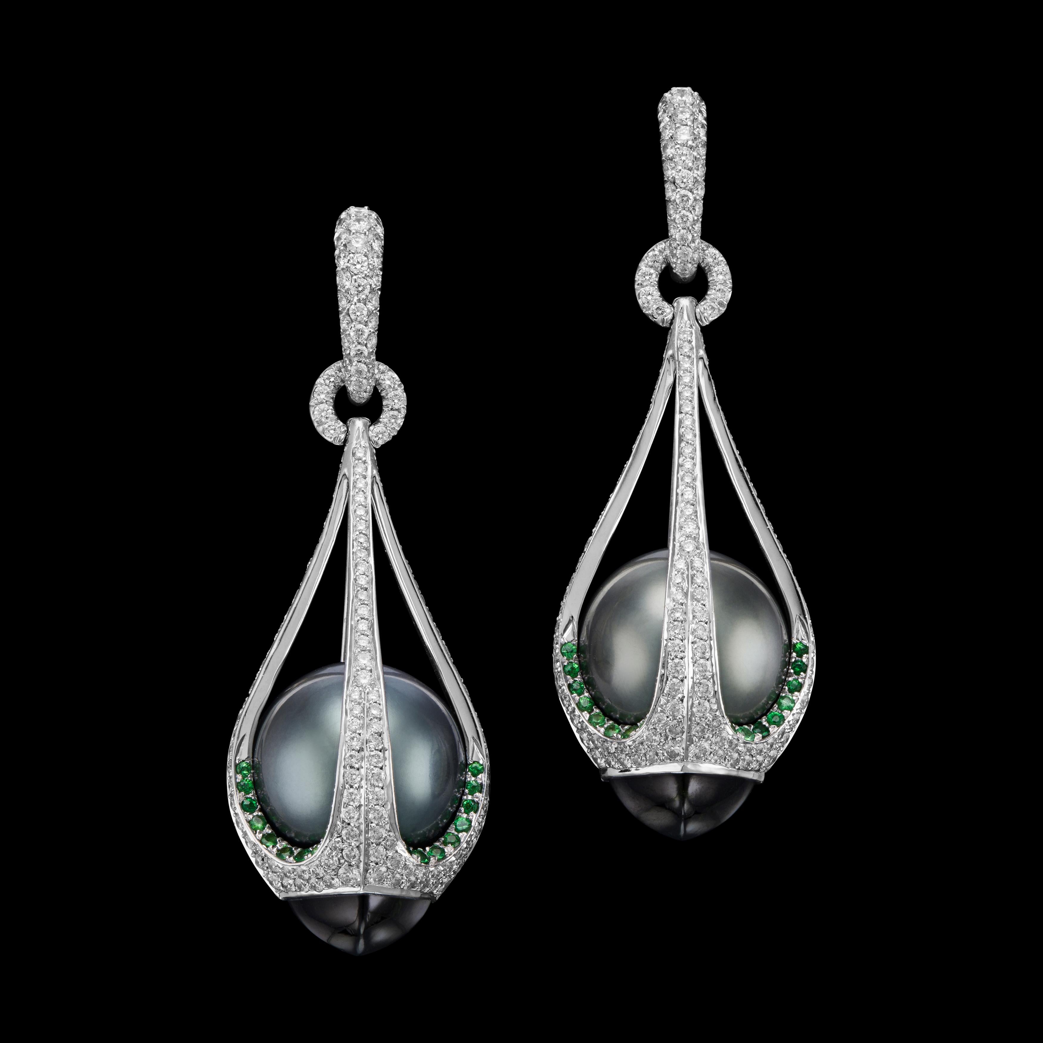 Drop-shape Tahiti black pearl earrings caged in diamond, tsavorite and tourmaline.