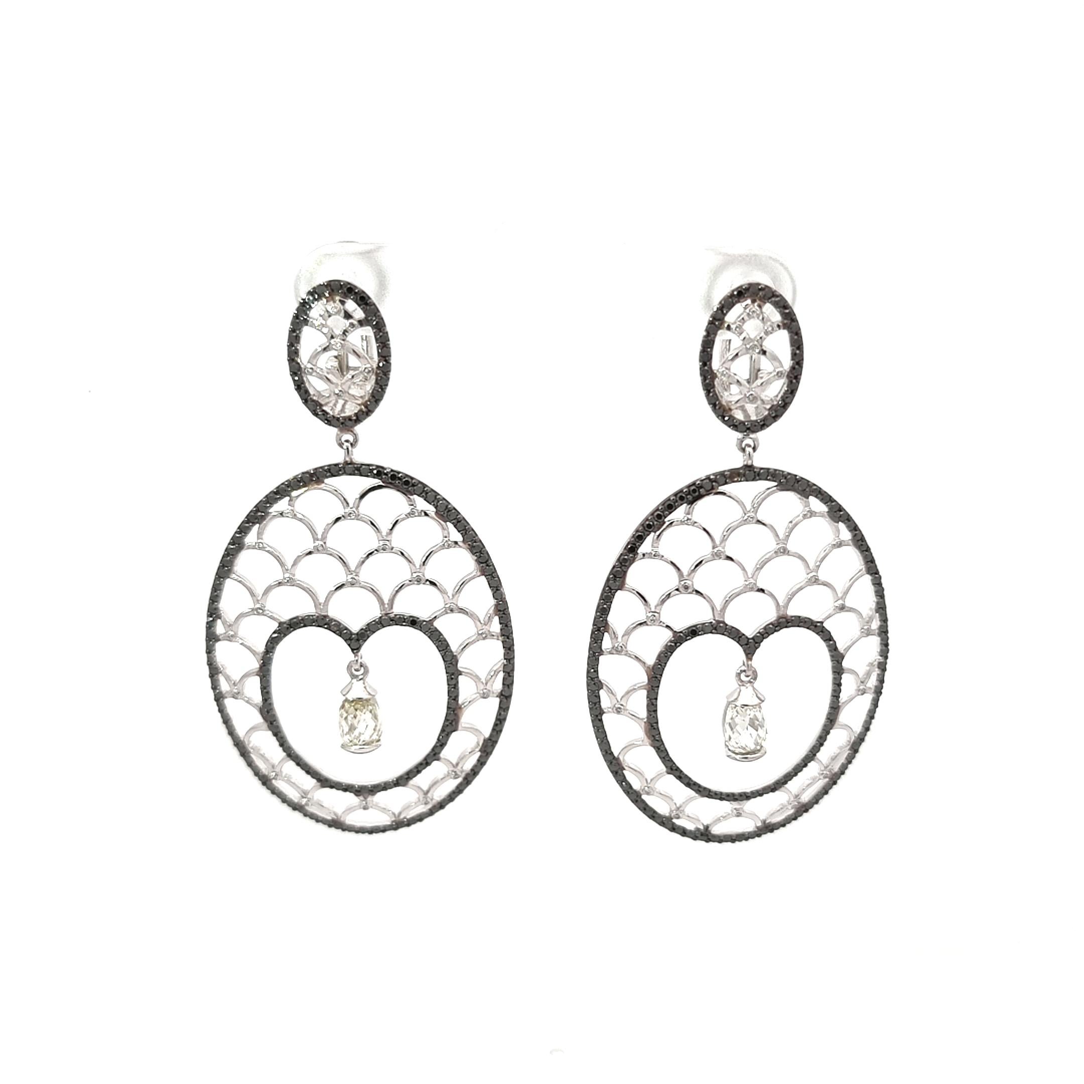 Teardrops in the Snow from VOTIVE’s Lace Collection are a poetic vision, capturing the fleeting elegance of frost fractals in glimmering 18K white gold. Inspired by the delicate uncertainties of a young heart, each earring features black and white