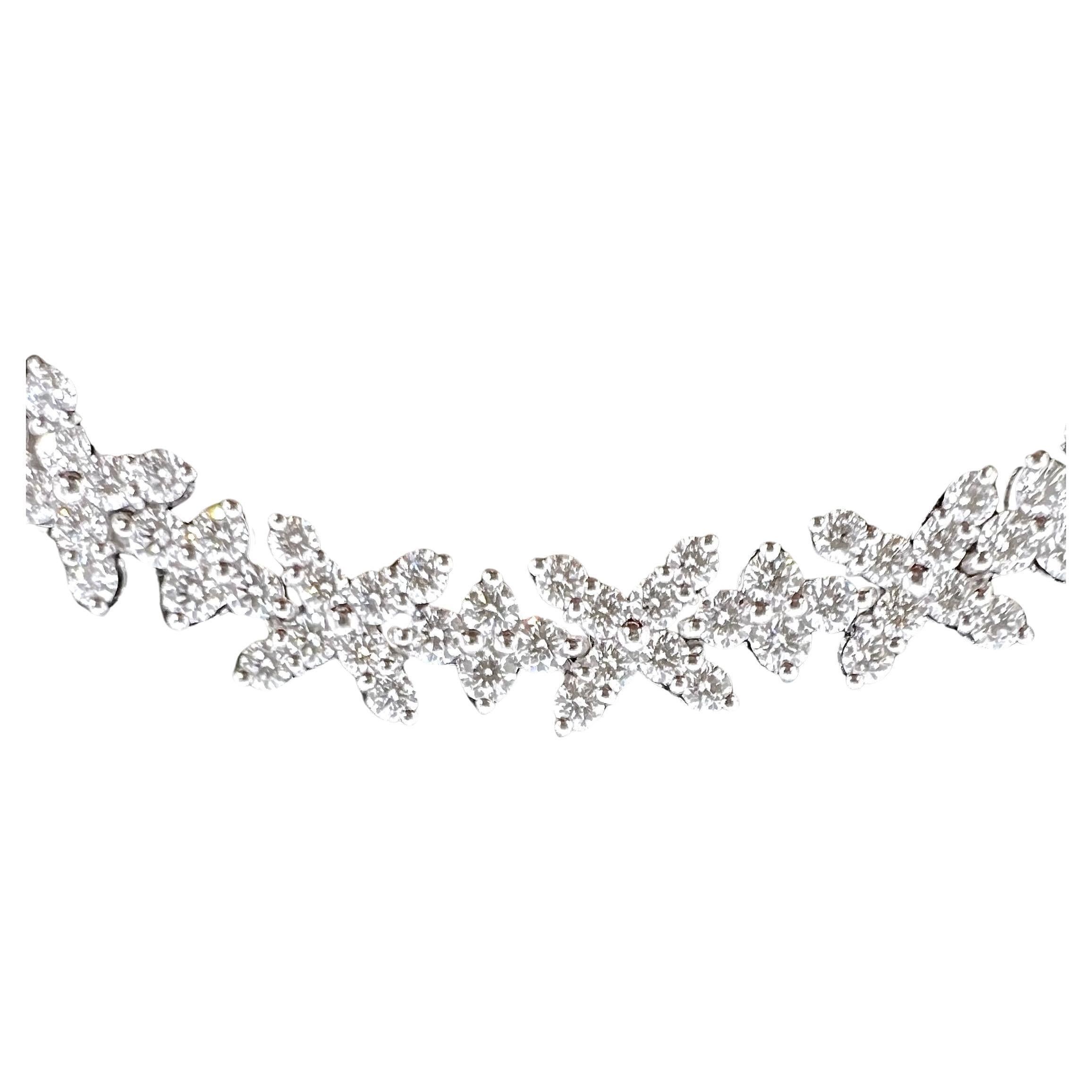 Perfect for the holiday's or luncheons, this diamond necklace is absolutely a must! It is not your typical, long diamond tennis necklace that everyone else has! This graduated diamond necklace is made up of X & O's pattern that gives a more