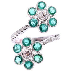 18 Karat White Gold Emerald and Diamond Double Flower Bypass Ring