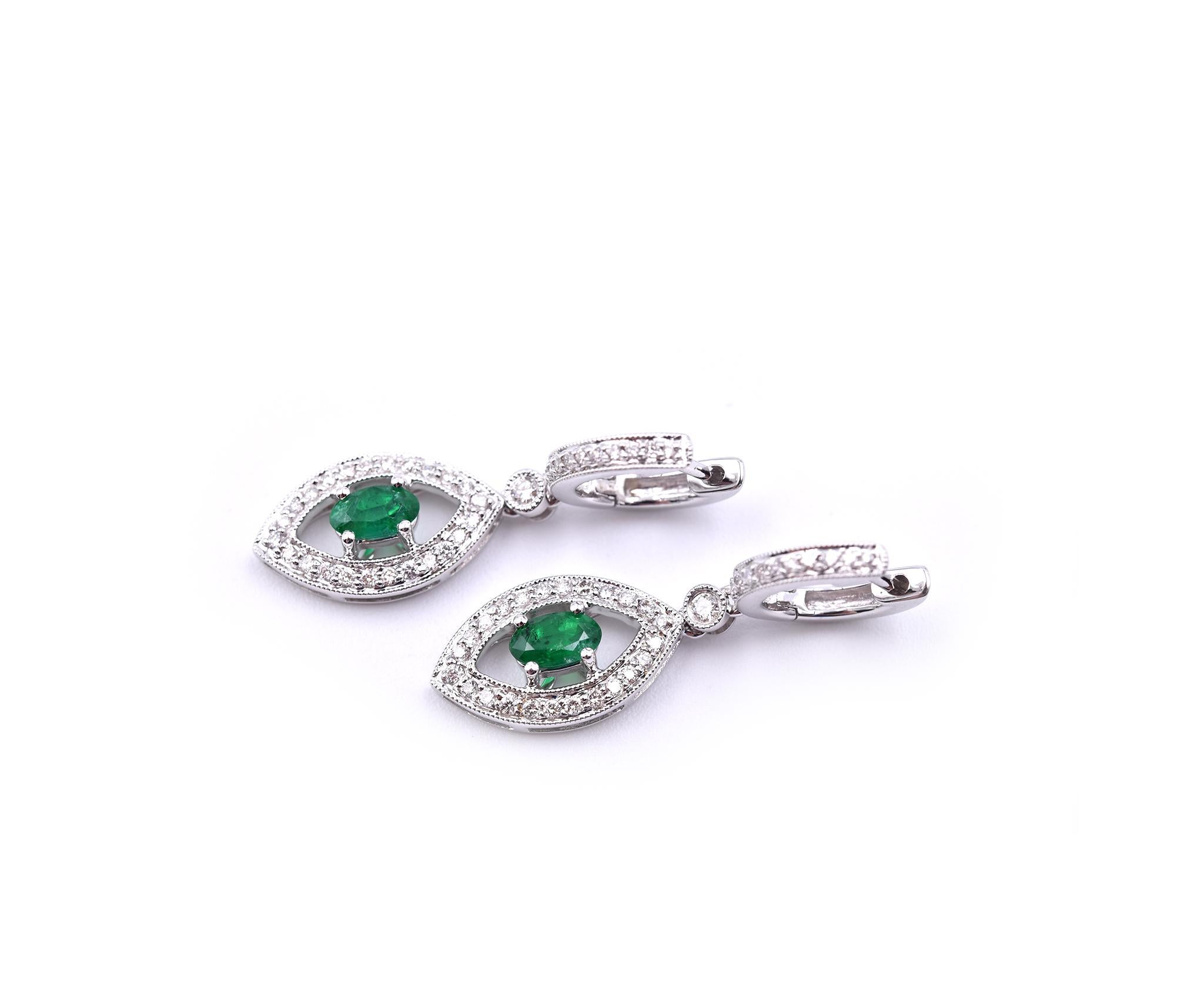 Oval Cut 18 Karat White Gold Emerald and Diamond Drop Earrings