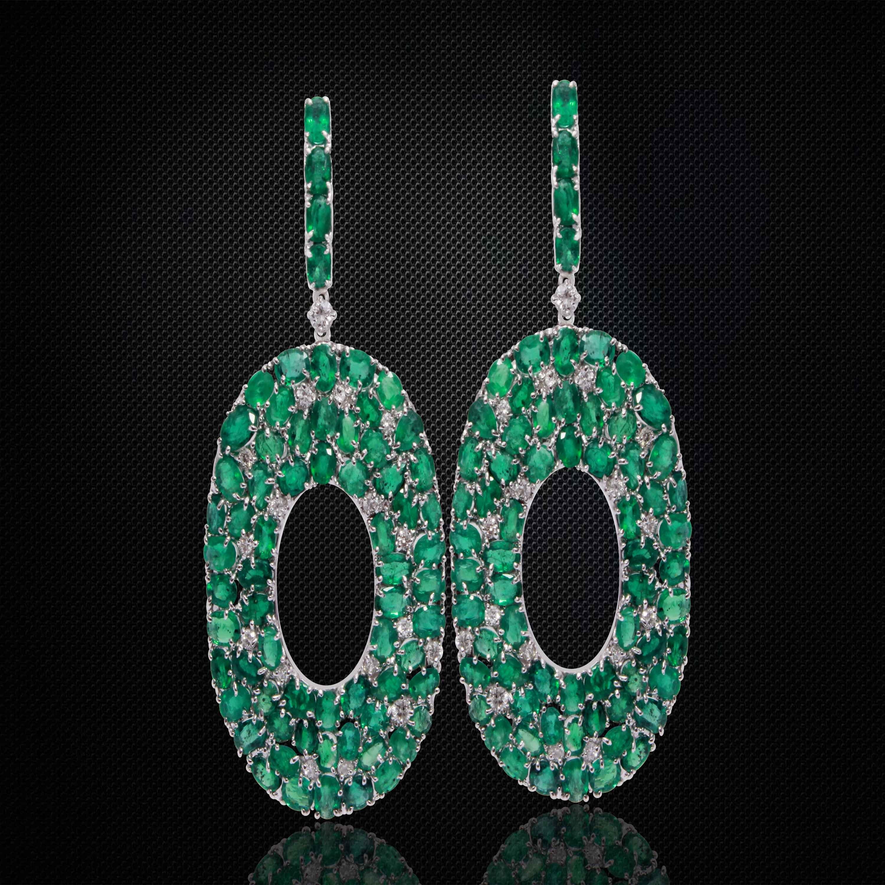 Stunning pair of Earrings embellished with 136 pieces of emeralds weighing 19.38 carats, with 35 pieces of round cut white diamonds weighing 1.08 carats.
The Earrings are handcrafted with 18K White gold and weighs approximately 28.480 grams.