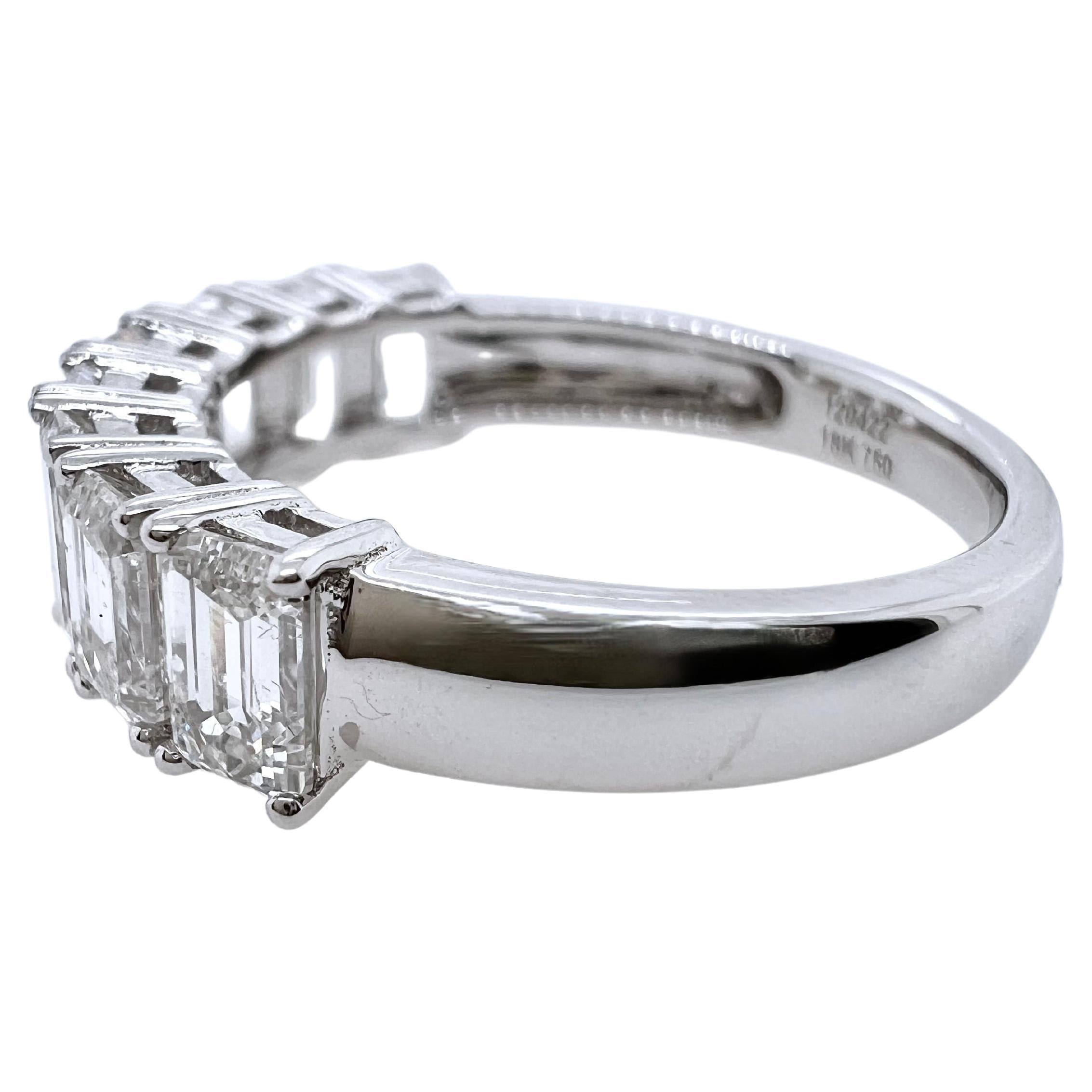 This classic emerald cut diamond band is timeless and stunning.  The 8 emerald cut diamonds are set in a straight
row to exhibit a clean, elegant look.  This is the ideal band to be worn alone or stacked with other rings!



Size: 6.5 (can be