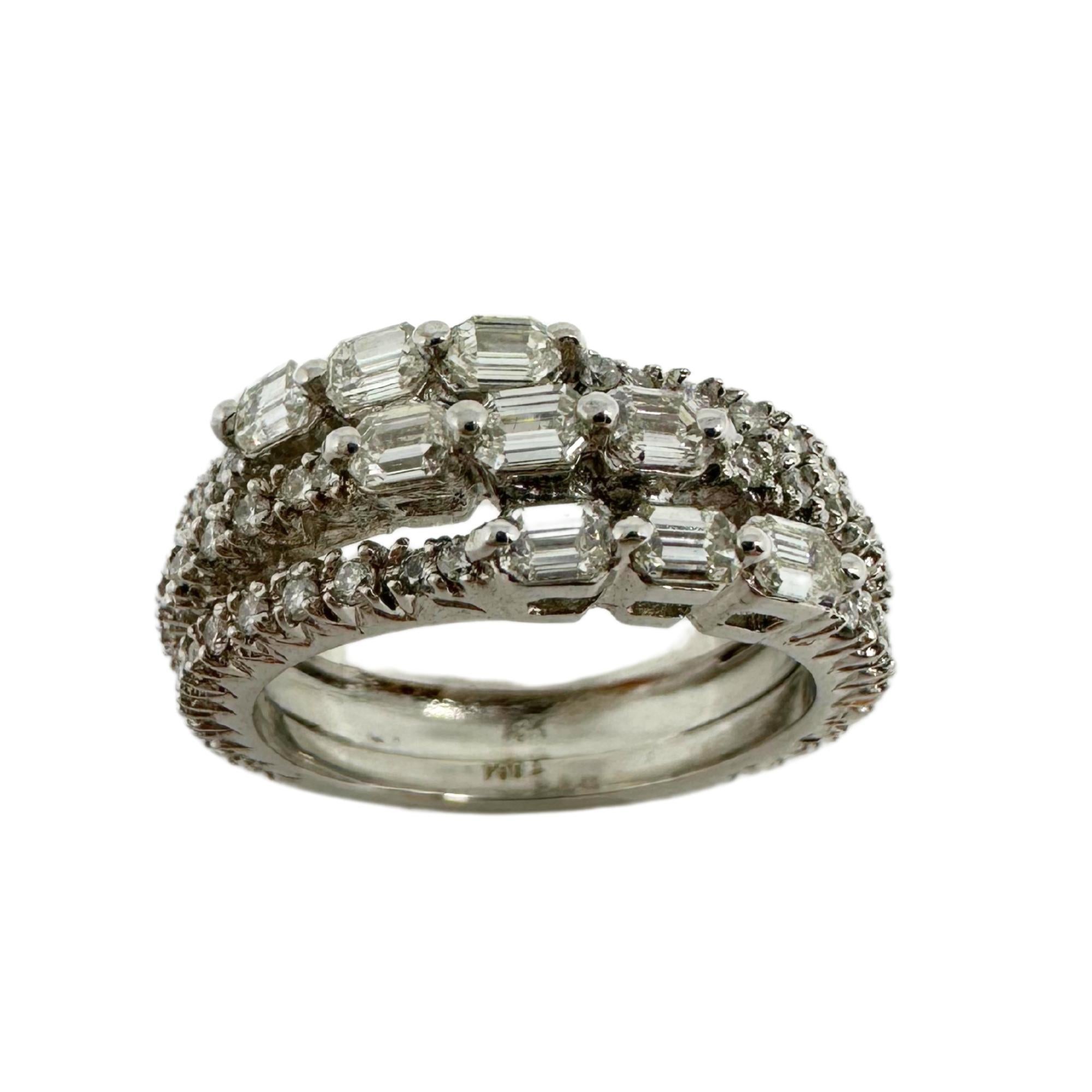 Exude elegance with our 18k White Gold Emerald Cut Diamond Band Ring. This 9.0 gram, size 7.25 ring features stunning 1.38 carats of diamonds, marked with 
