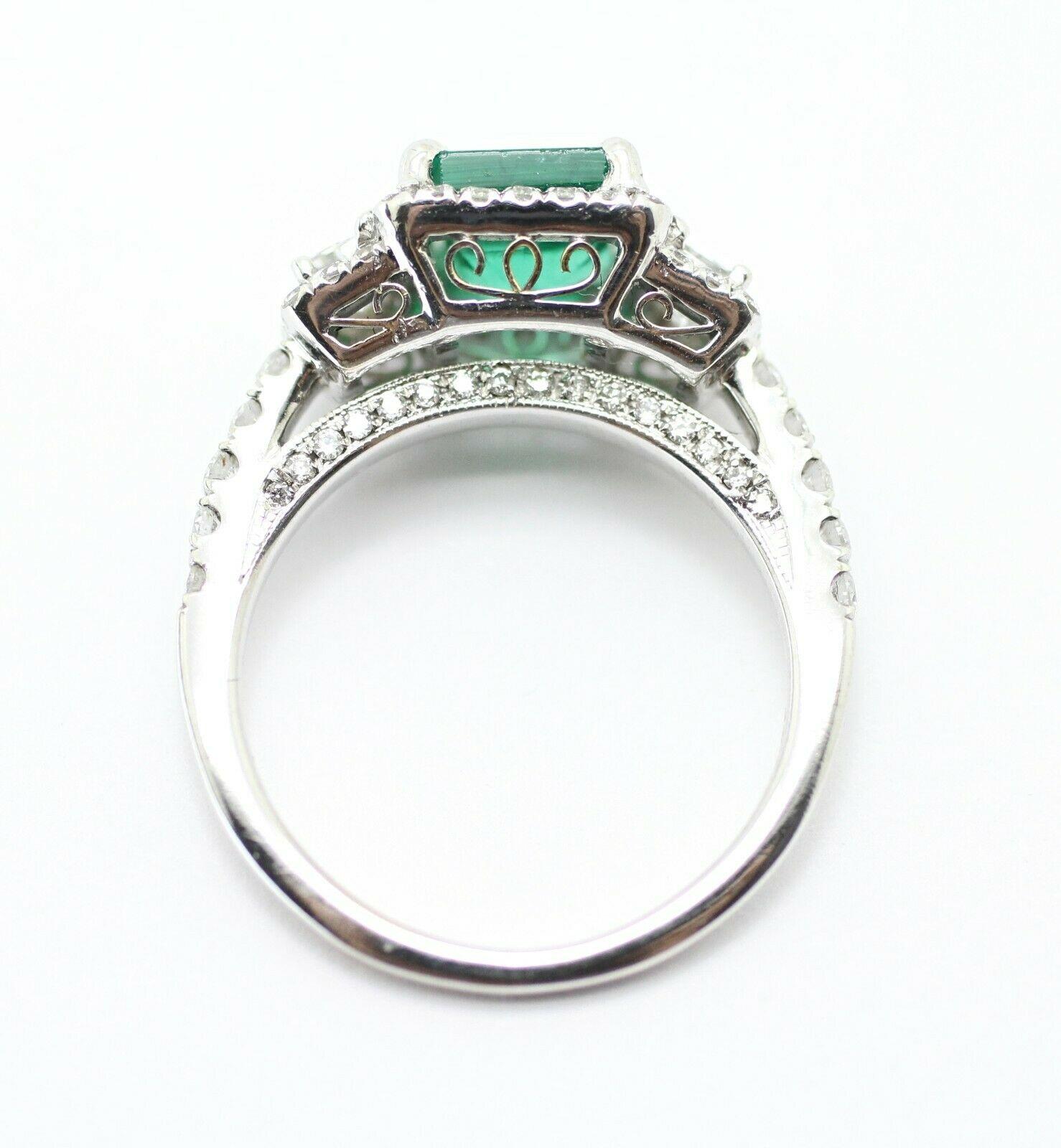 Contemporary 18k White Gold Emerald Cut Emerald and Diamond Ring