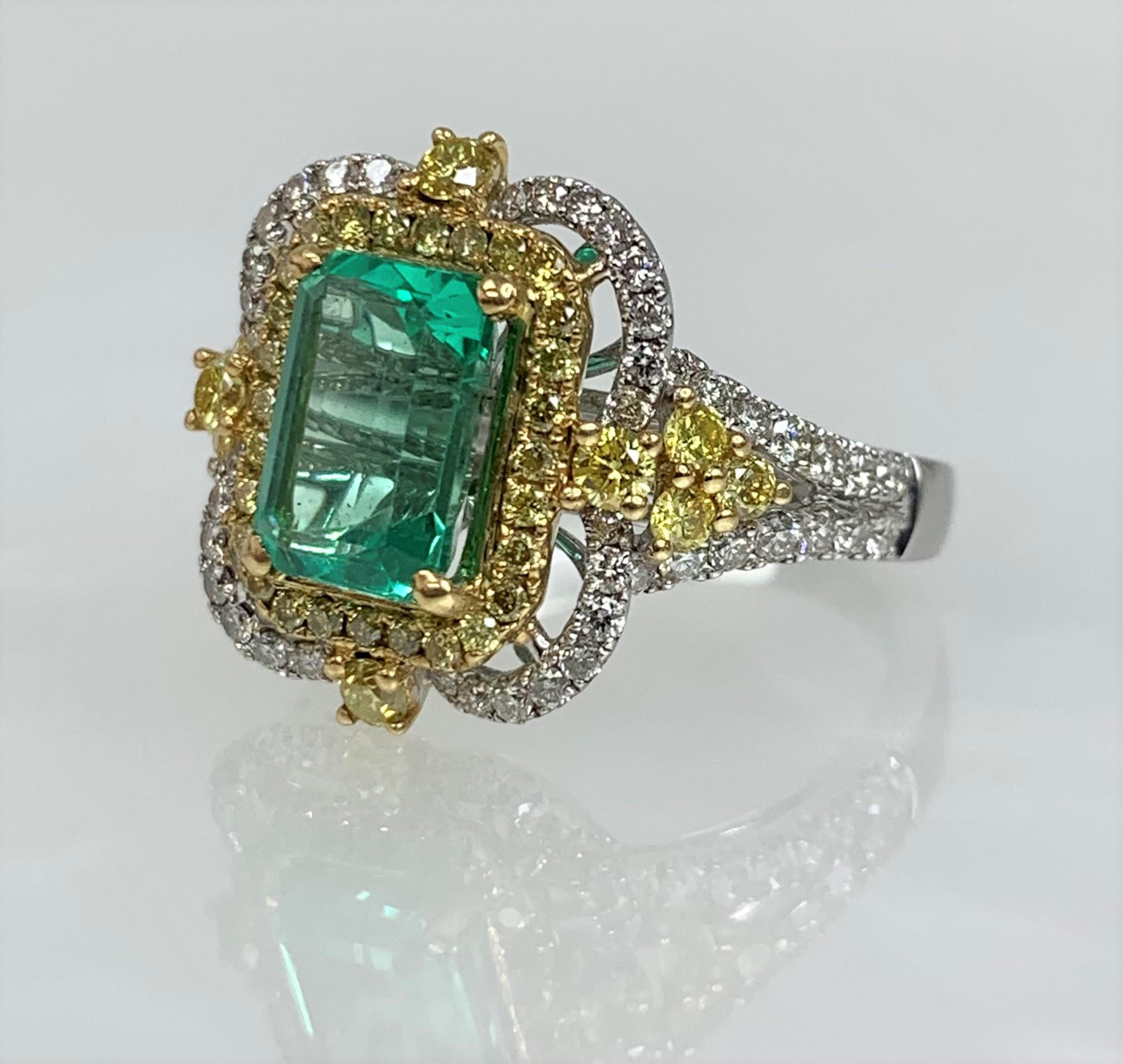 An exquisite and exceptional one- of- a kind colorful ring featuring an bright emerald cut emerald weighing 1.68 carats accented by 0.53 carats of yellow diamonds and 0.58 carats of white diamonds.

*Approximate stone measurements:
Height: