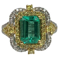 18K White Gold Emerald Cut Emerald White and Yellow Diamond Ring