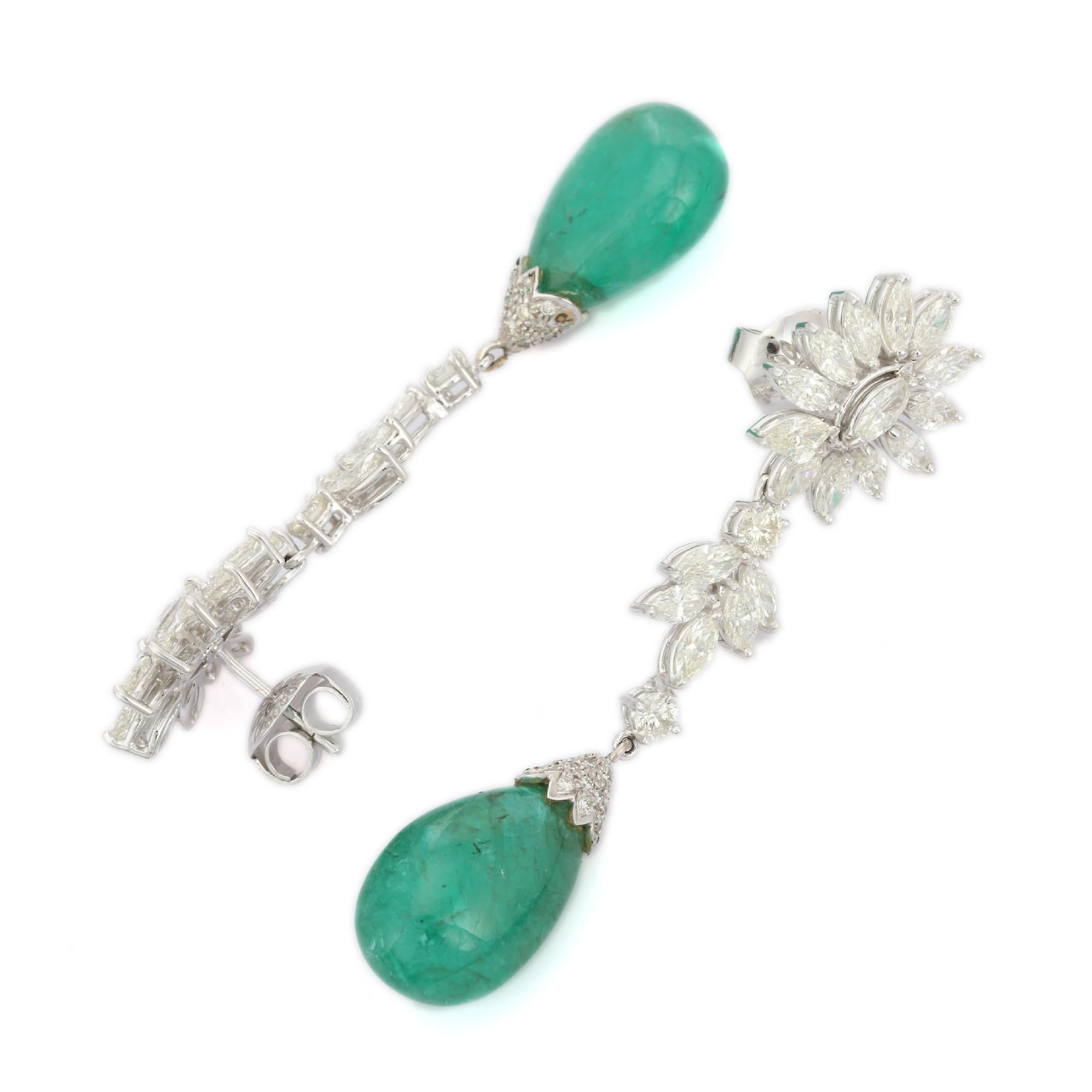 Diamond and Drop Emerald Dangle Earrings in 18K Gold to make a statement with your look. You shall need statement dangle earrings to make a statement with your look. These earrings create a sparkling, luxurious look featuring drop emerald.
Emerald