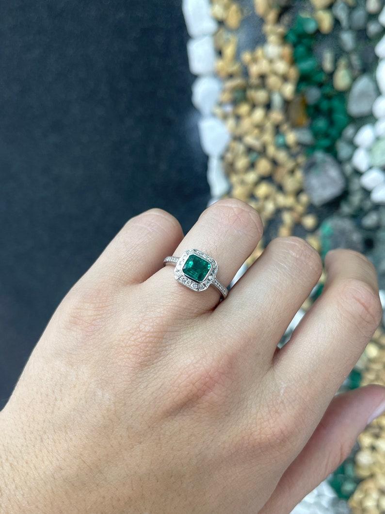 Contemporary 18K White Gold Emerald & Diamond Halo Ring - 1.45tcw Emerald Cut Engagement Ring For Sale