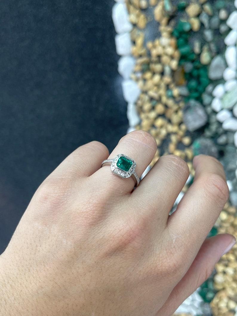 Women's 18K White Gold Emerald & Diamond Halo Ring - 1.45tcw Emerald Cut Engagement Ring For Sale