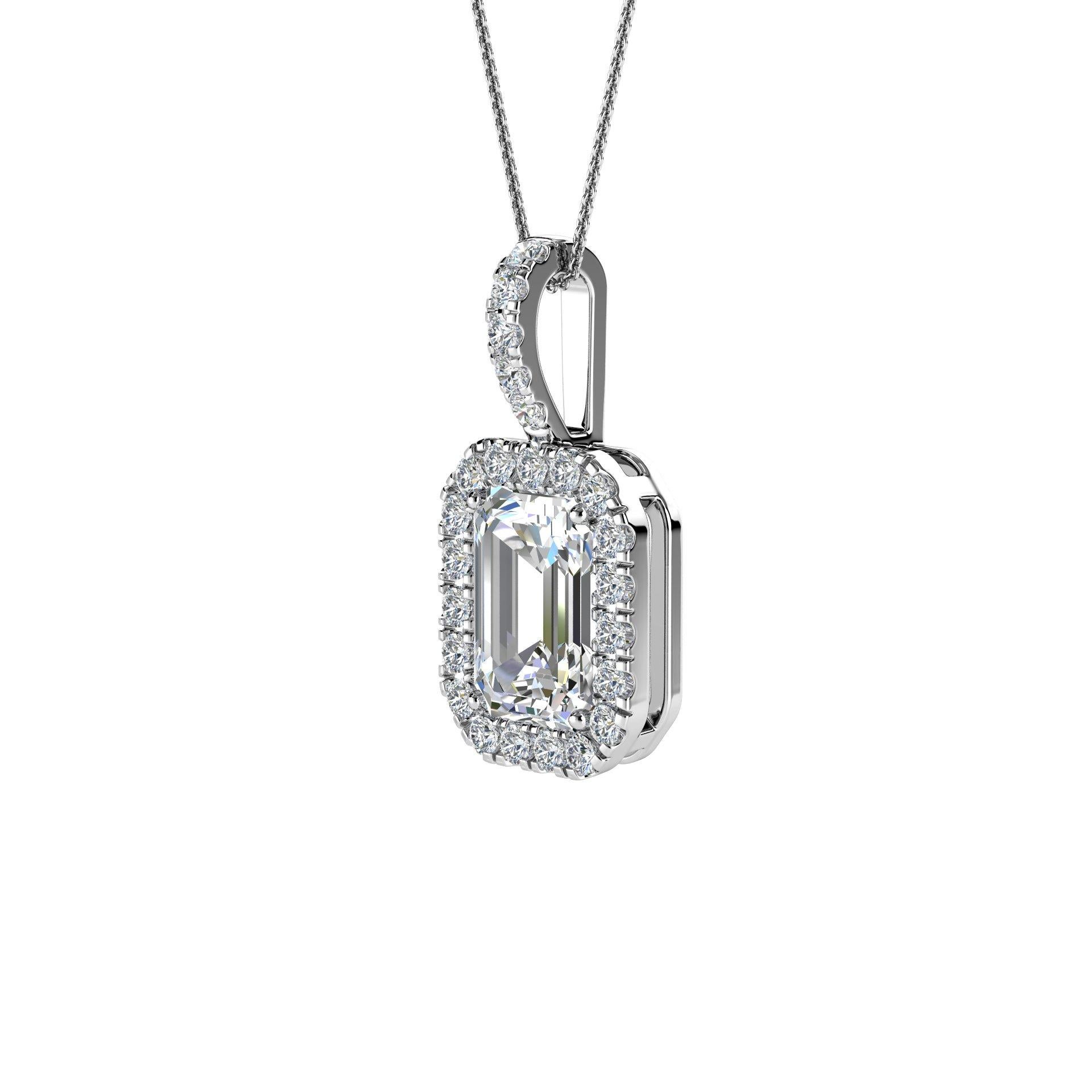 Questo delicato pendente presenta un diamante a forma di smeraldo del peso totale di circa 0,65 carati (6 mm x 4 mm) circondato da un'aureola di 23 diamanti tondi taglio brillante perfettamente abbinati del peso totale di circa 0,12 carati. Il