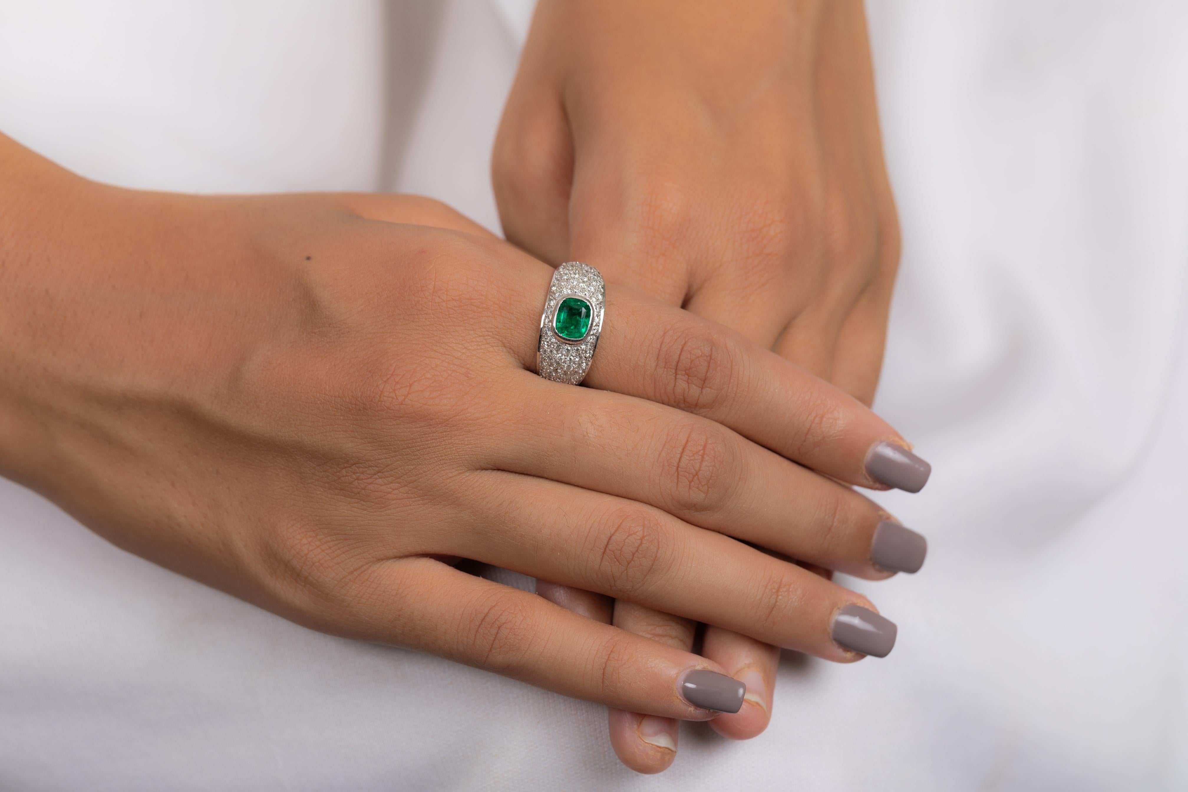 For Sale:  18K White Gold Emerald Ring Along with Clustered Diamonds  10