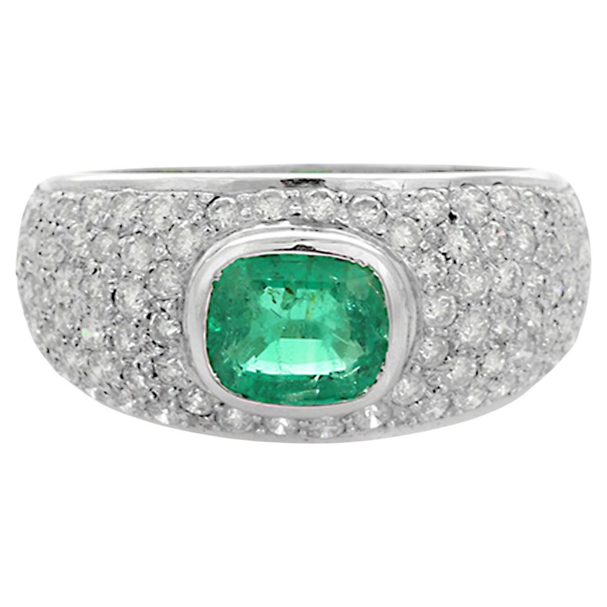 For Sale:  18K White Gold Emerald Ring Along with Clustered Diamonds