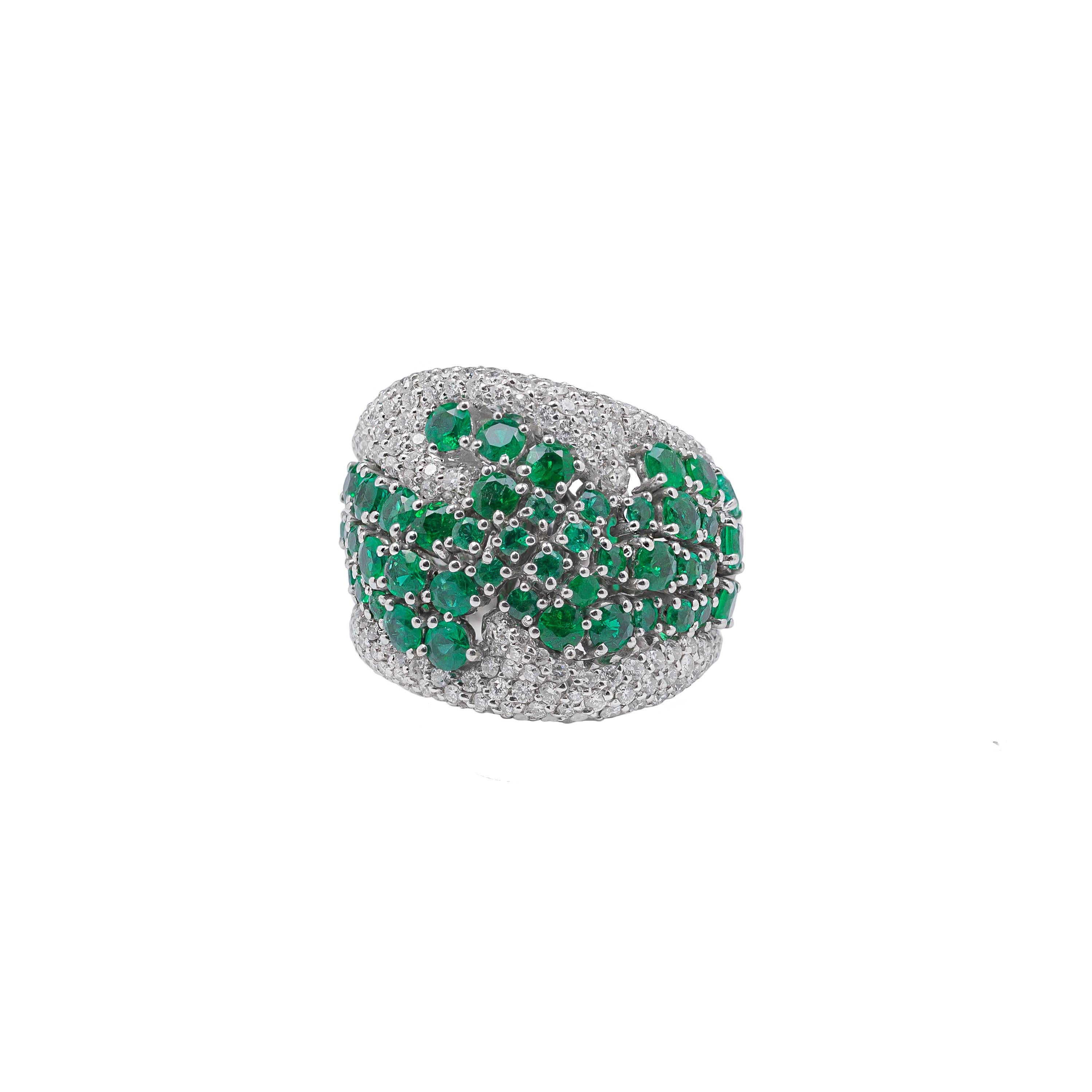 Contemporary 18k White Gold, Emeralds, and Diamonds Ring For Sale
