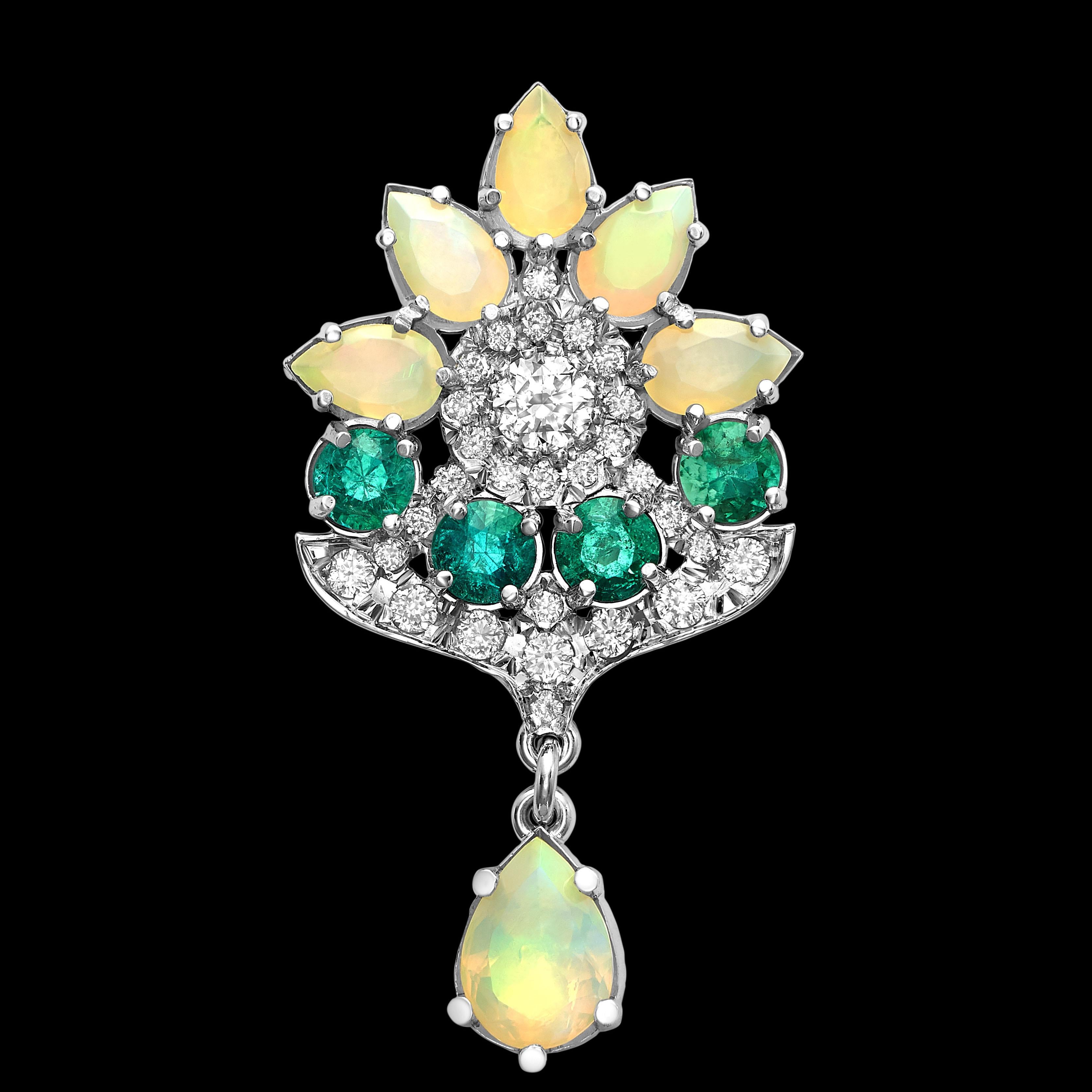 Dangling earrings in 18K gold set with brilliant diamonds (2.7ctw), clear green emeralds (1.5ctw), and Walo opals in a flower motif. Alpha back double clasp securely holds the earring in place. A nice splash of sparkle and colour in a designer