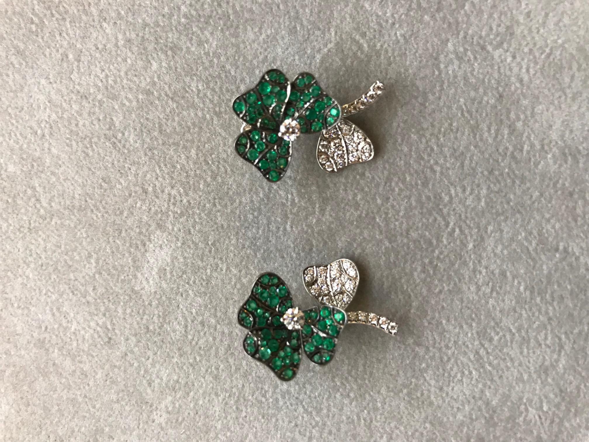 Paving: Emeralds 0,94 ct. & White Diamonds 0,70 ct. 
Material: Palladium 950; White Gold 750; 
Length: 2,5 cm 
Width: 1,5 cm 

Earrings are available with different stones and also in different sizes. 
They can be worn as studs or as earclips. The