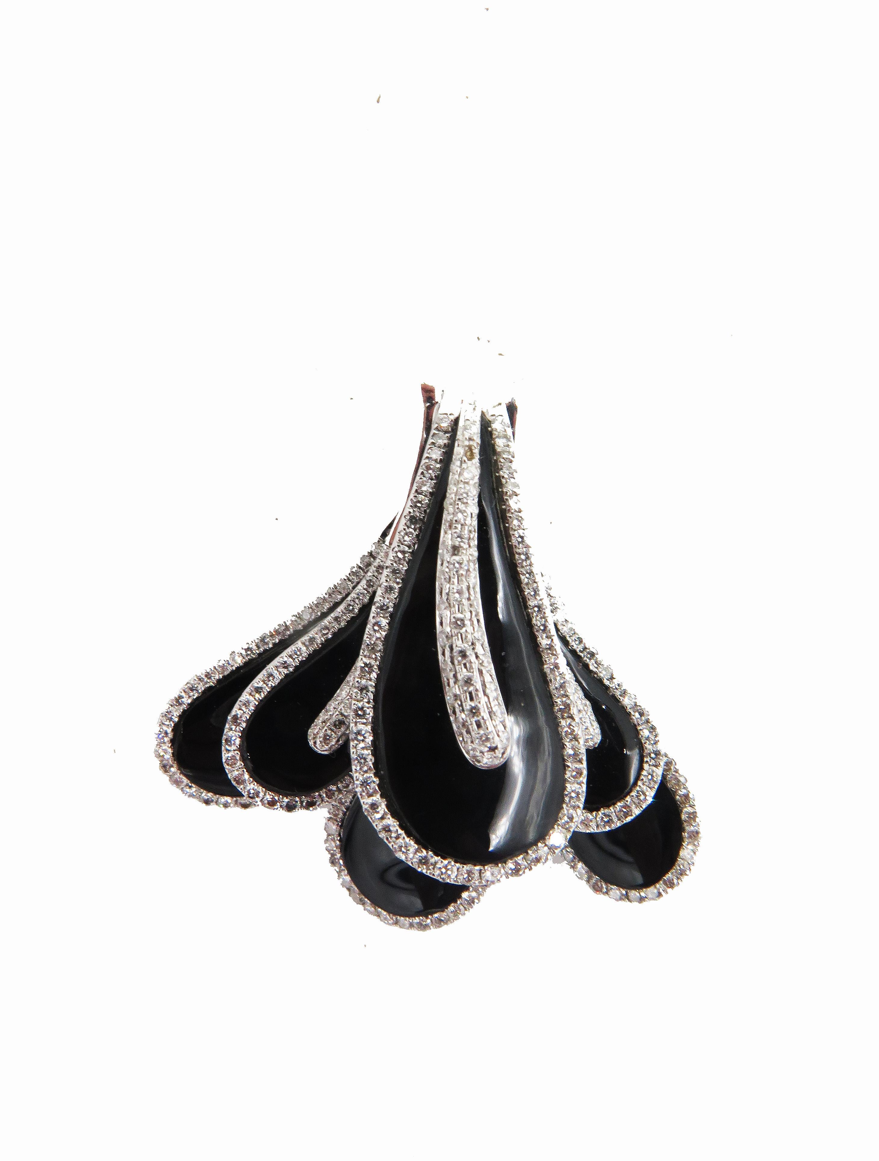 A beautiful, 18k white gold diamond & enamel pendant. The, pendant weighs 12.36 grams with approx 1cts in diamonds. 1.5 L x 1.3 W. Crafted in 18k white gold with a beautiful polish finish and unique design. The pendant is beautifully crafted and the