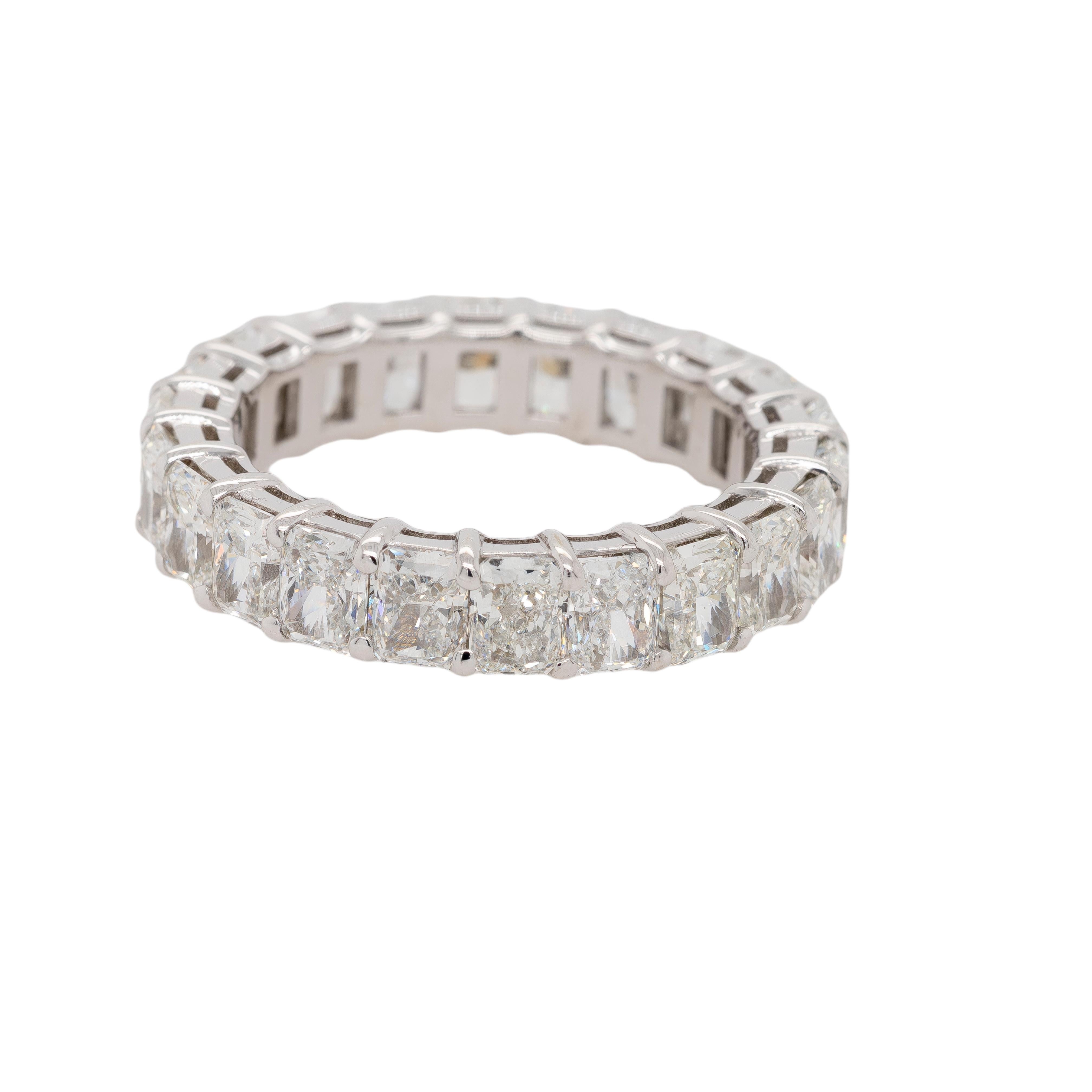 This stunning 18K White Gold Eternity Band features a breathtaking 5.28 carats total weight of radiant-cut diamonds encircling the entire band. Each diamond is meticulously set to create a continuous band of brilliance, symbolizing eternal beauty