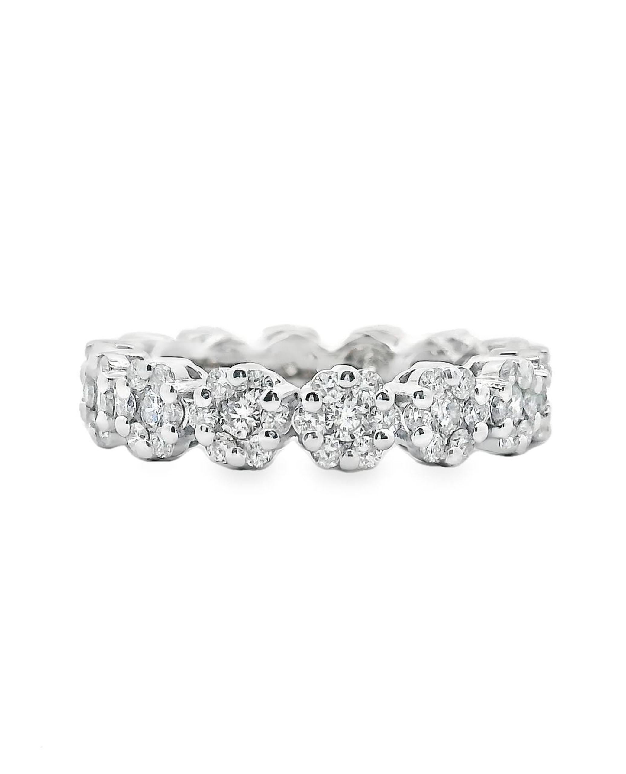 Pre- Owned 18K white gold eternity ring with 98 round diamonds weighing a total of 1.68 carats. 

*Width 4.5mm
* Size 7 Band
*G/H1 color, VS2/S1 clarity