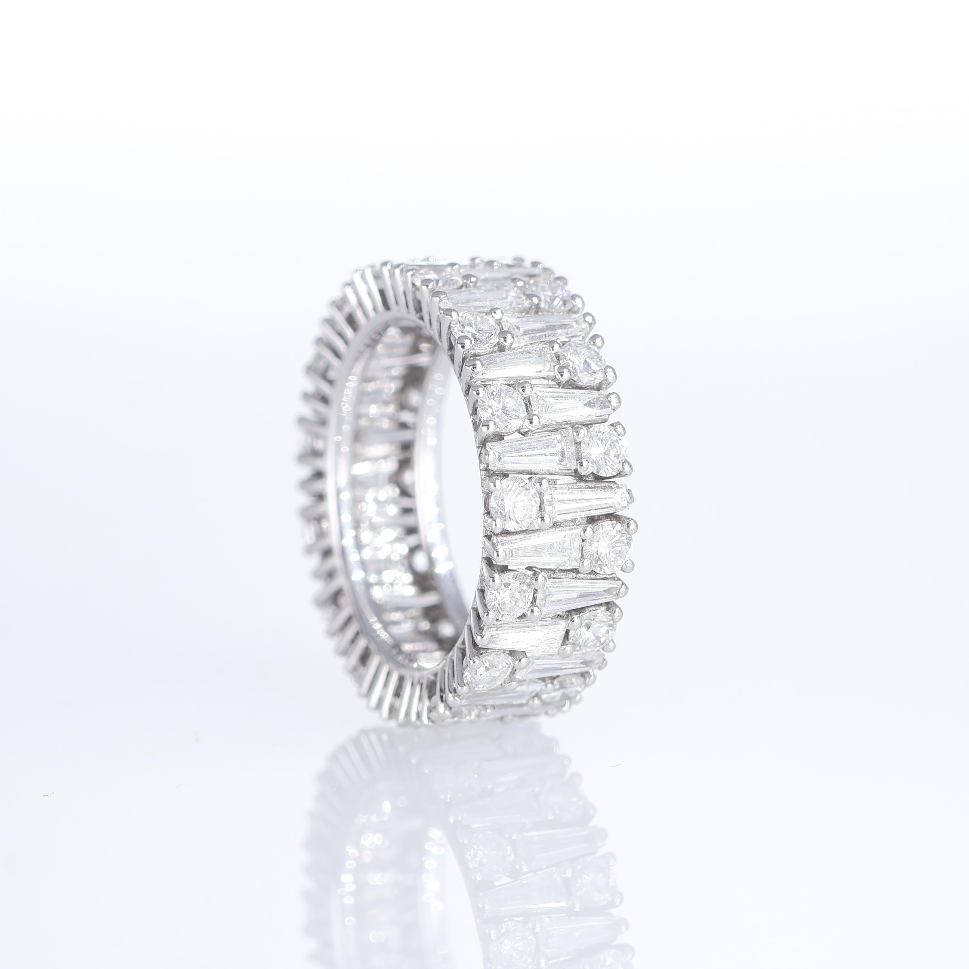 Brilliant Cut 18K White Gold Eternity Ring with Brilliant, Trapezoid, and Round-Cut Diamonds For Sale