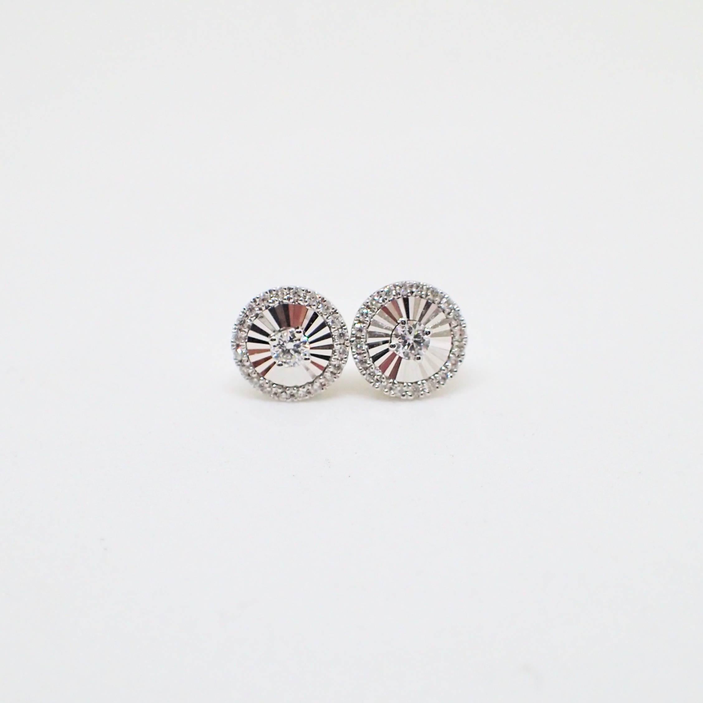 Contemporary 18 Karat White Gold Fan Style Stud Earrings Are Set with 0.19 Carat of Diamond