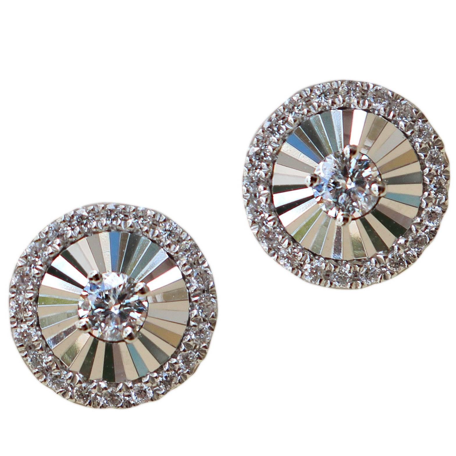 18 Karat White Gold Fan Style Stud Earrings Are Set with 0.19 Carat of Diamond