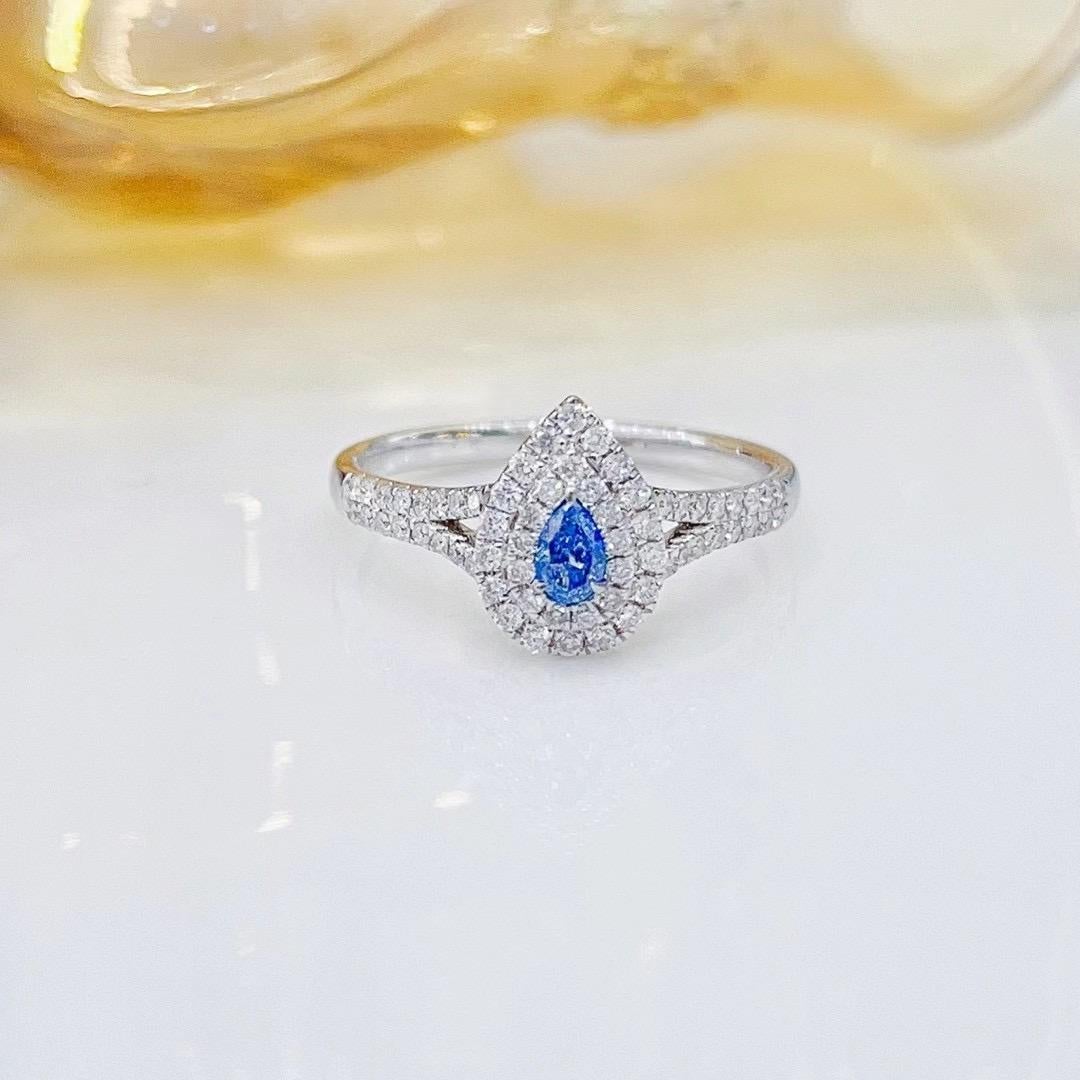 18K White Gold Fancy Blue Diamond & Diamond Ring

1 Fancy Blue Diamond - 0.16 CT
Diamonds - 0.35 CT
Total Weight - 2.78 GM