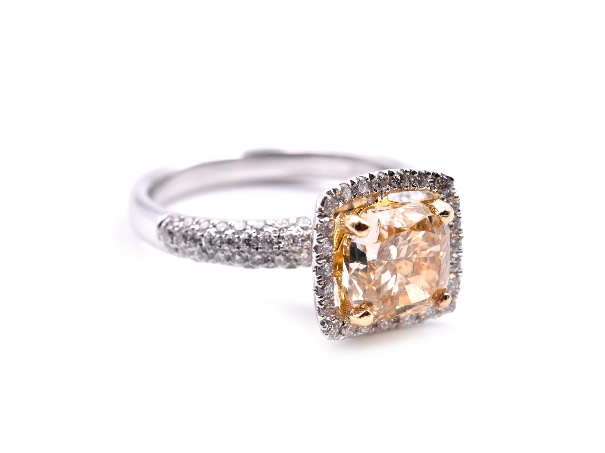 Designer: custom design
Material: 18k white gold
Fancy Yellow Diamond: 1 cushion cut= 1.72ct
Color: fancy yellow
Clarity: VS2
Diamonds: 103 round brilliant cut= .59cttw
Color: G
Clarity: VS
Ring Size: 6 ½ (please allow two additional shipping days