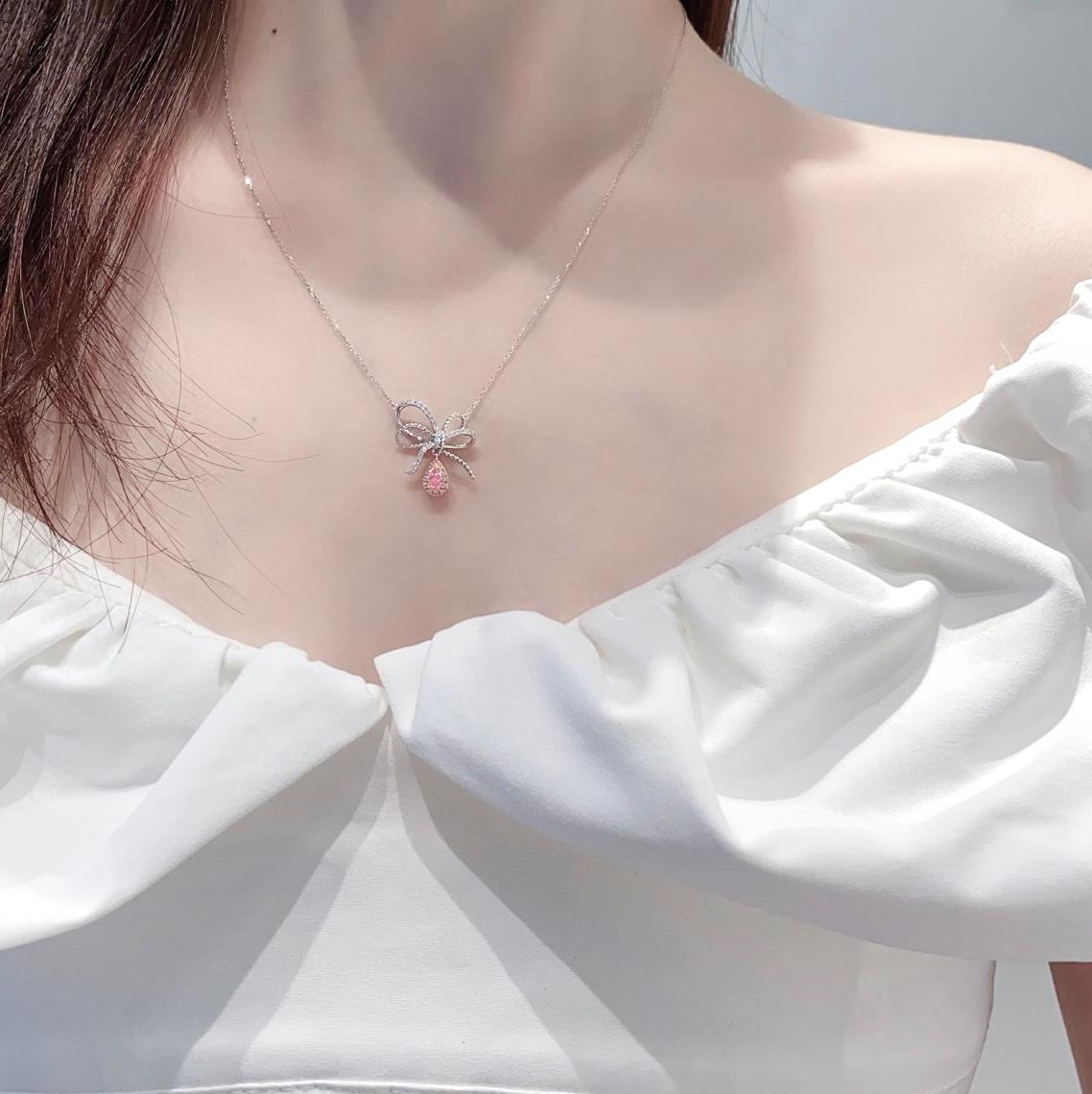 Pear Cut 18K White Gold Fancy Pink Diamond Bow Design Pendant Necklace with Diamonds For Sale