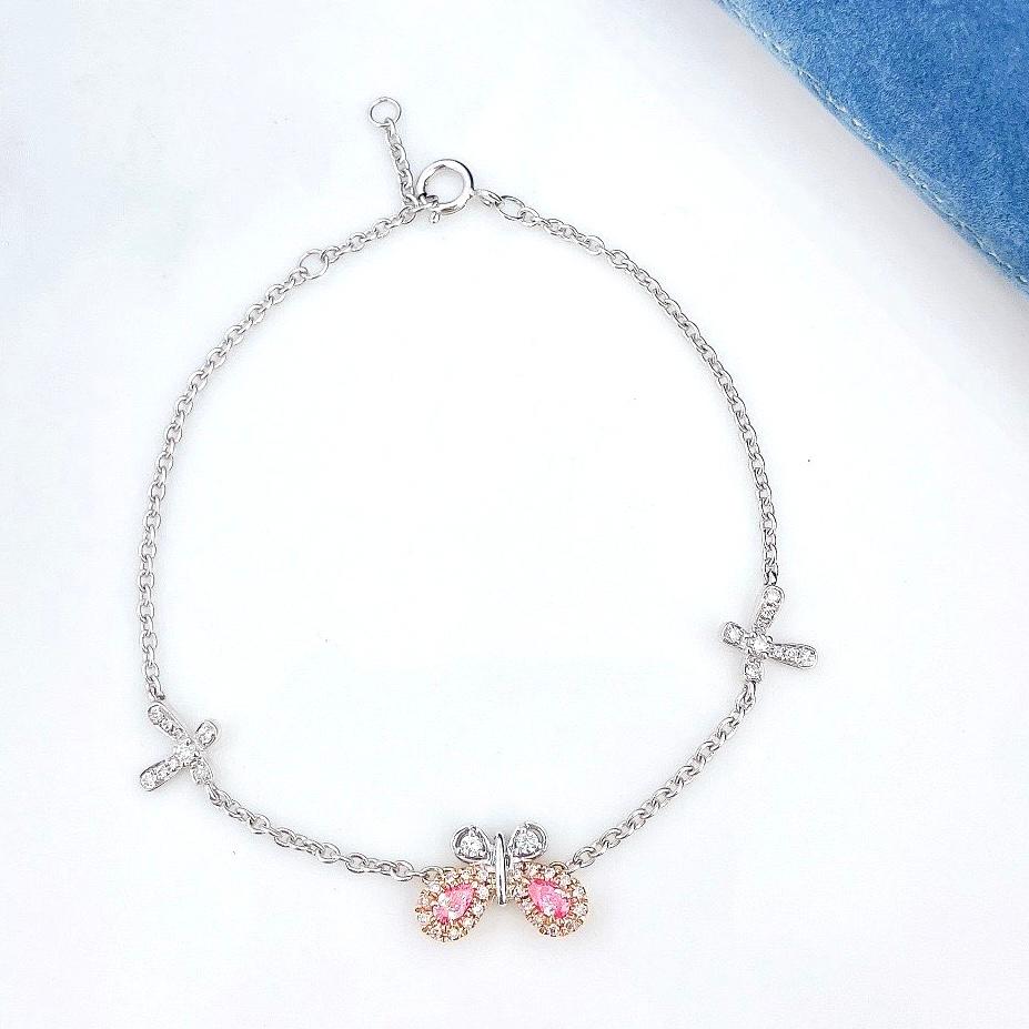 18K White Gold Fancy Pink Diamond Butterfly Bracelet with Diamonds 

2 Fancy Diamonds - 0.14 CT
Diamonds - 0.20 CT
18K White Gold - 2.87 GM

The pink diamond is a captivating and rare gemstone, its hue evoking the most delicate and precious things
