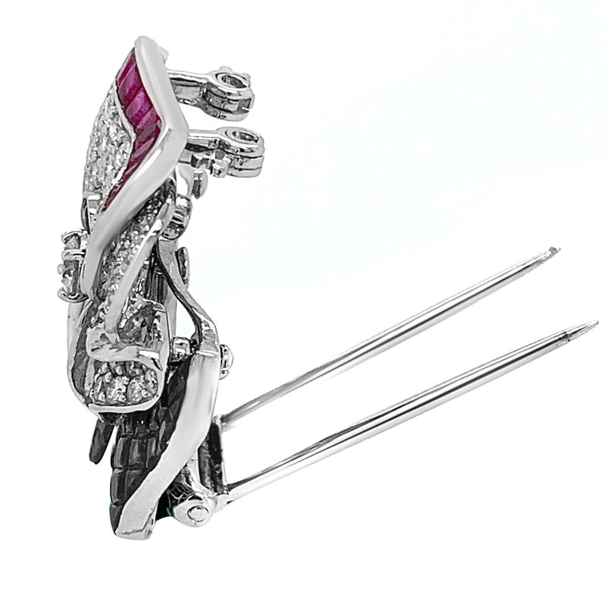 18k White Gold Fancy Ruby Diamond Brooch 

Metal: 18k White Gold 
Condition: Excellent
Gemstone: Ruby, Diamond
Item Weight: 12.8 grams
Length: 1 inch
Width: 1 inch

SKU#PB-01515