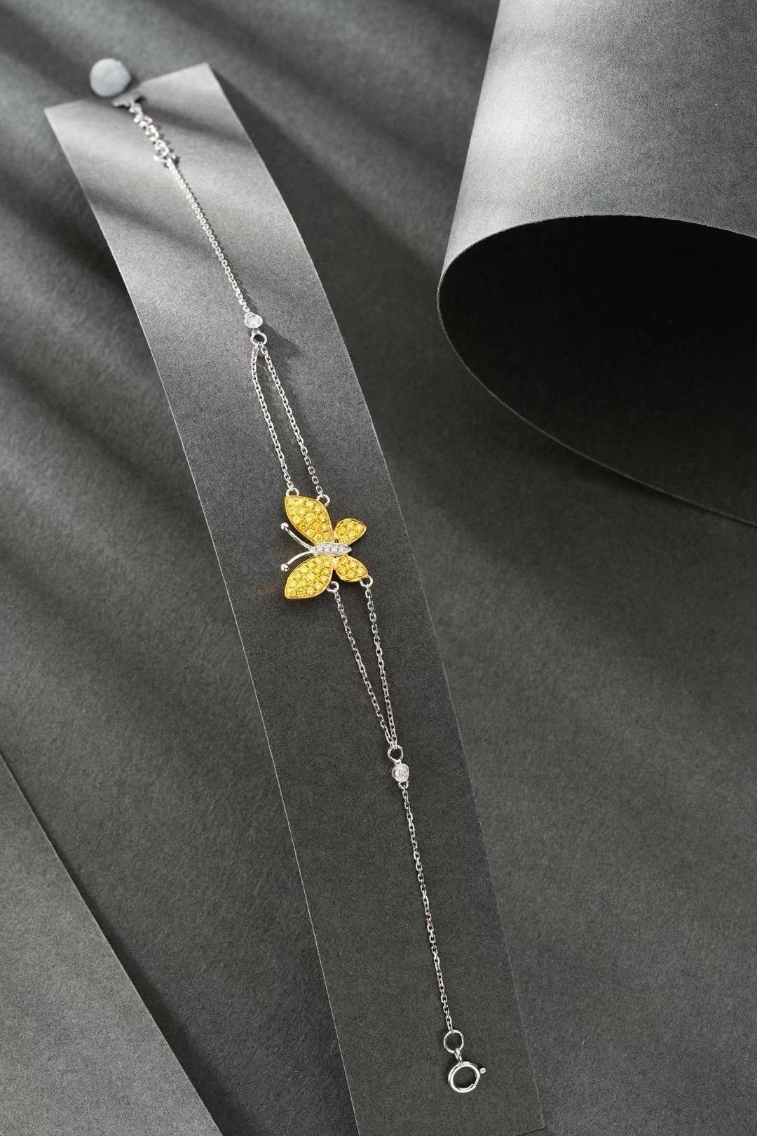 Round Cut 18K White Gold Fancy Yellow Diamond & Diamond Butterfly Bracelet For Sale