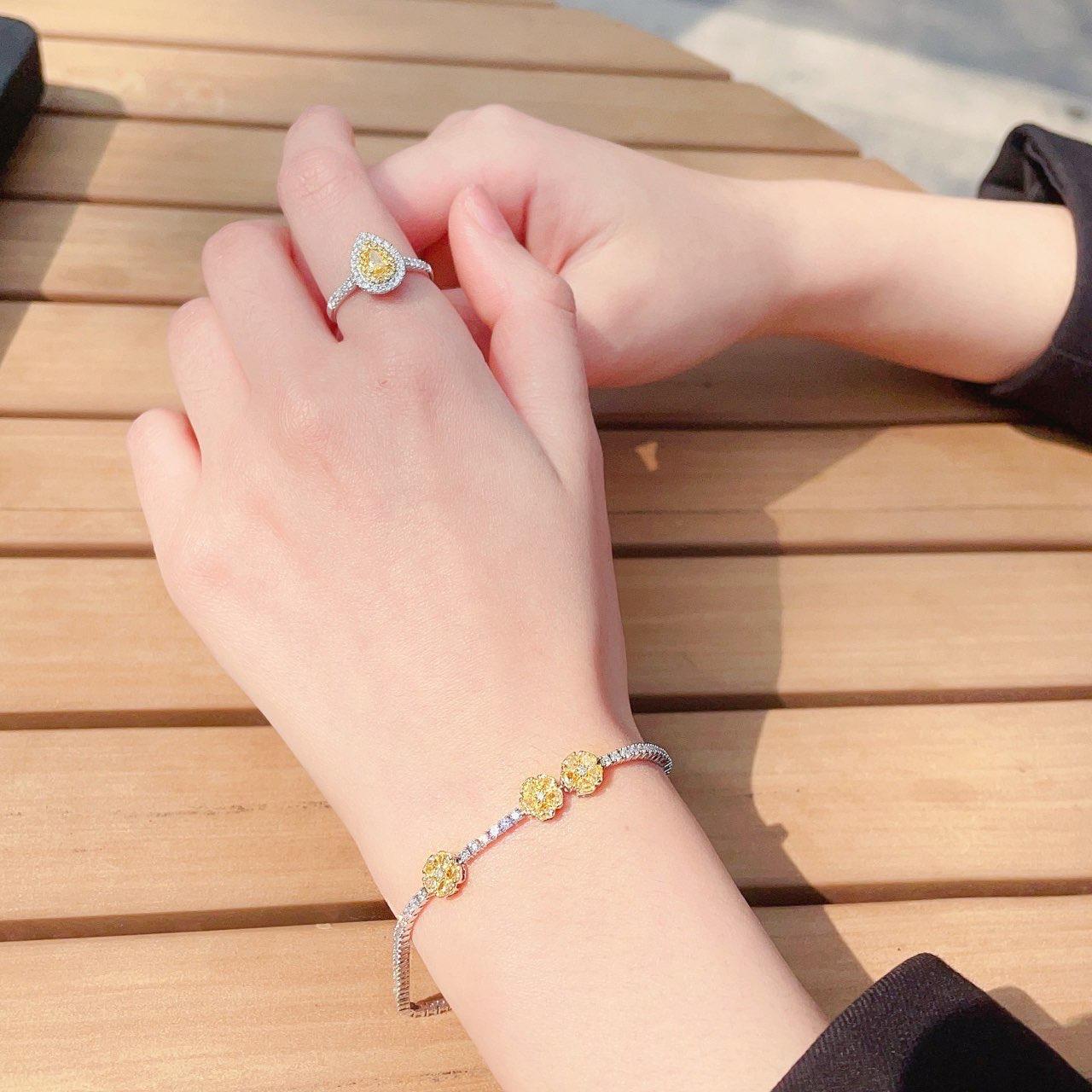 Modern 18K White Gold Fancy Yellow Diamond & Diamond Flower Bracelet For Sale
