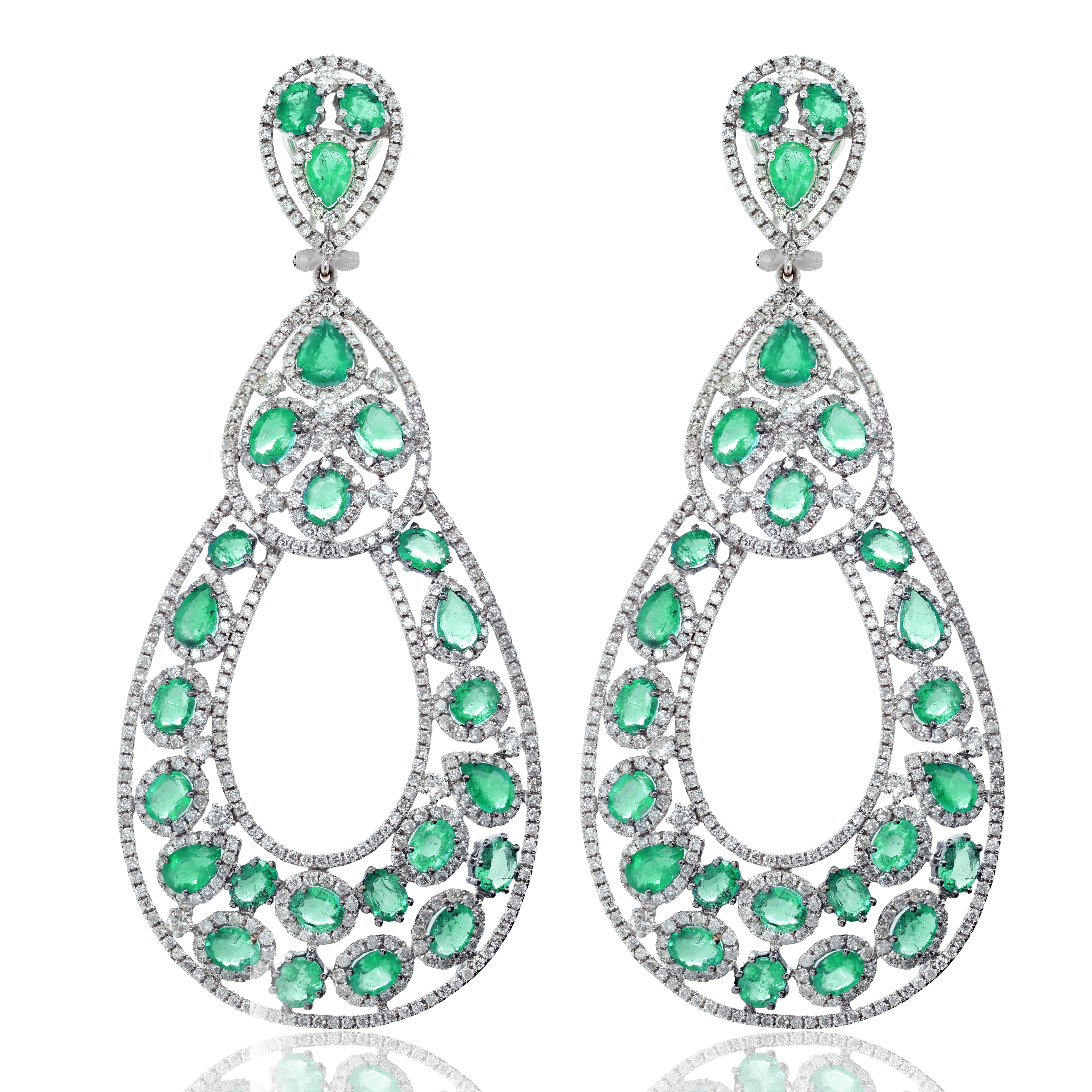 18k white gold diamond and emerald fashion earrings features 9.50 carats of diamonds and 18.40 carats of green emeralds