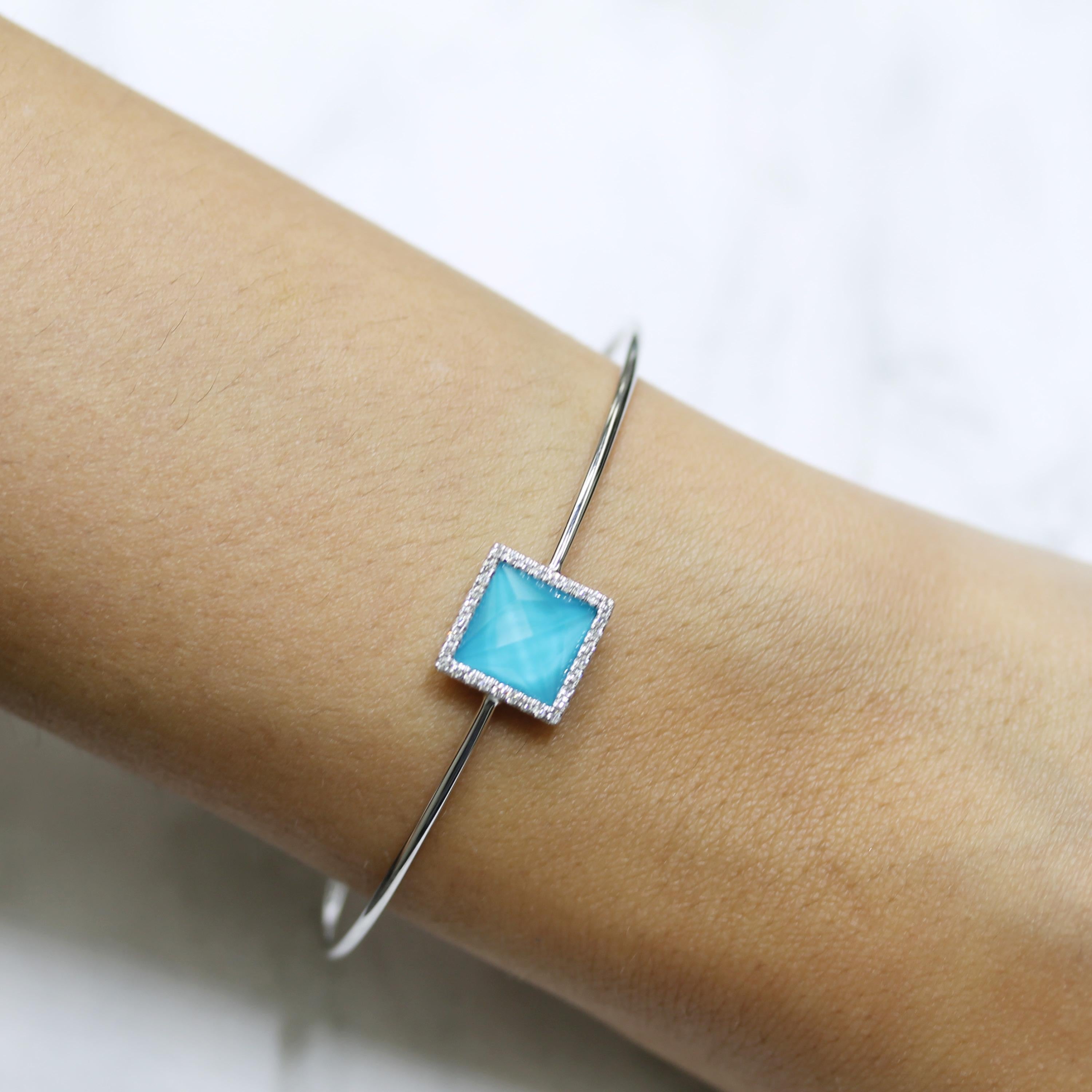 St. Barths Blue Flexible Bracelet featuring a cushion, checker-cut, White Topaz layered with Natural Arizona Turquoise, Diamond Halo, set in 18K white gold. The St. Barths Blue collection from Doves by Doron Paloma takes you to the crystal clear,