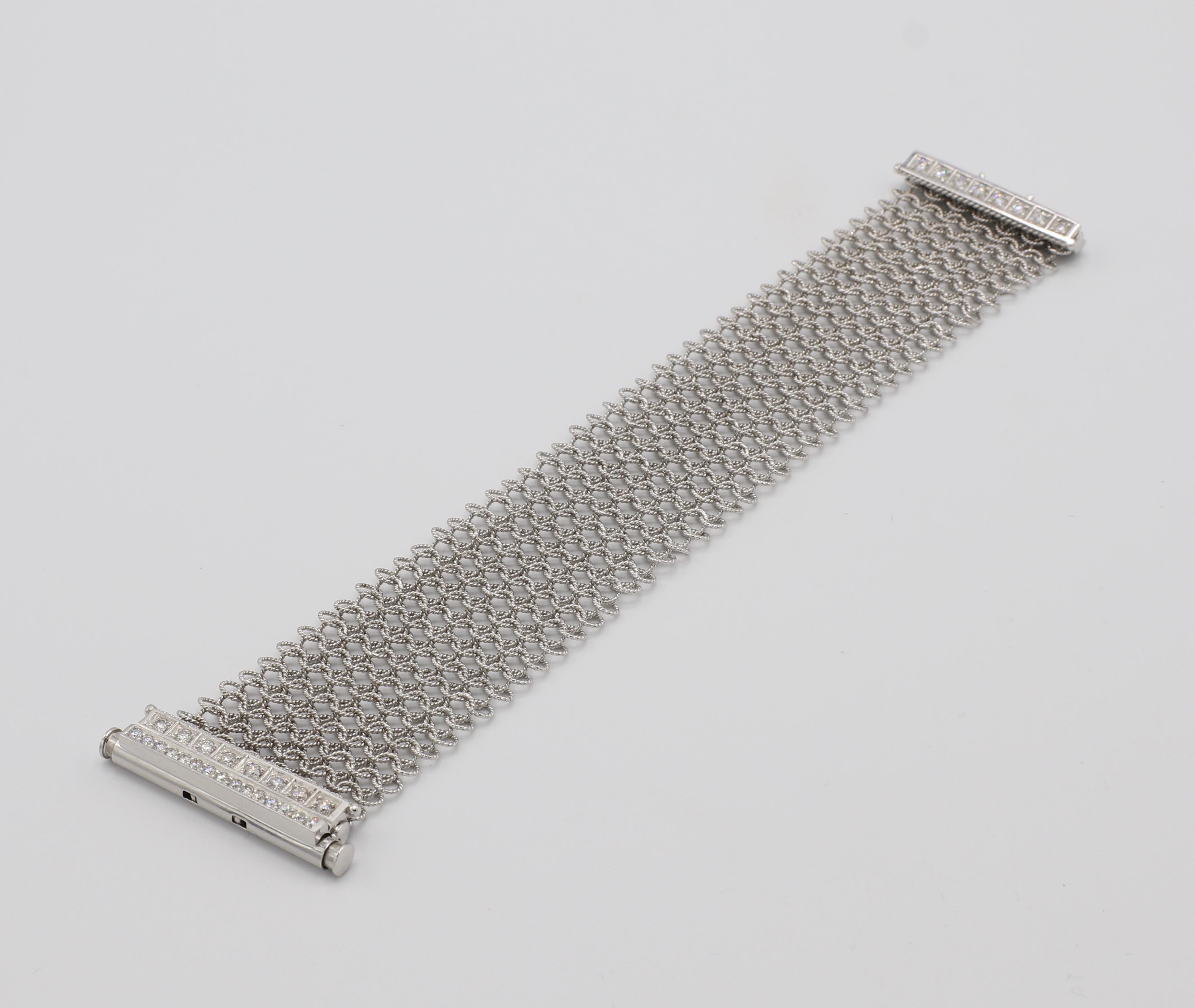 18K White Gold Flexible Diamond Mesh Bracelet 

Metal: 18k white gold
Weight: 38.67 grams 
Diamonds: Approx. 1.30 carats round brilliant cut diamonds, G VS
Length: 6.25 inches
Width: 1.25 inches 
Markings: 