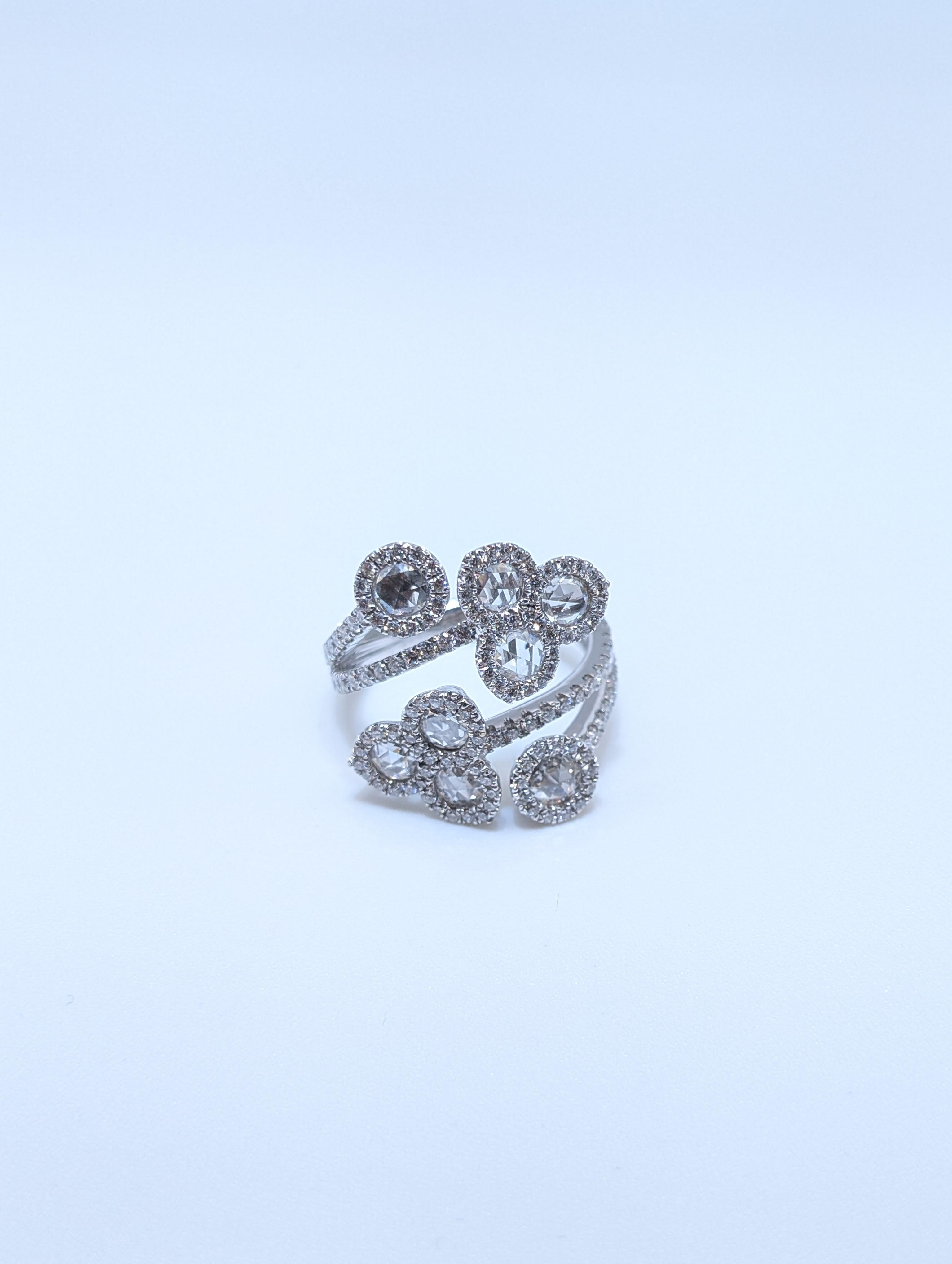 Elevate your jewelry collection with this stunning floral-inspired bypass ring crafted in luxurious 18K white gold. Featuring a total of 2.03 carats of dazzling diamonds, this ring showcases a unique openwork design with multiple floral diamond