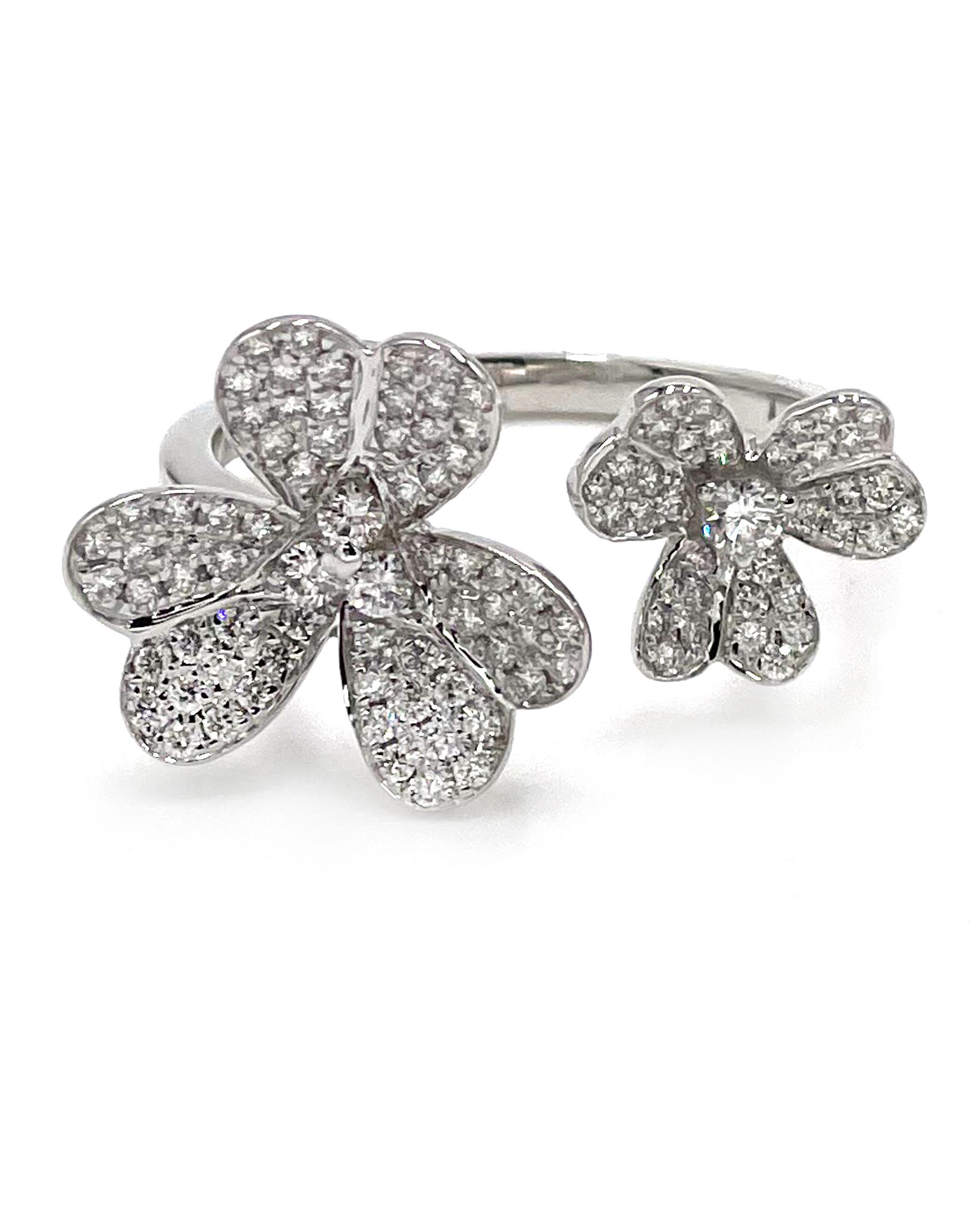 Just in time for Spring! This 18K white gold flower ring is furnished with round pave set diamonds with a total weight of 0.62 carat.

* Diamonds are G color, VS2/SI1 clarity
* Finger size 6.5