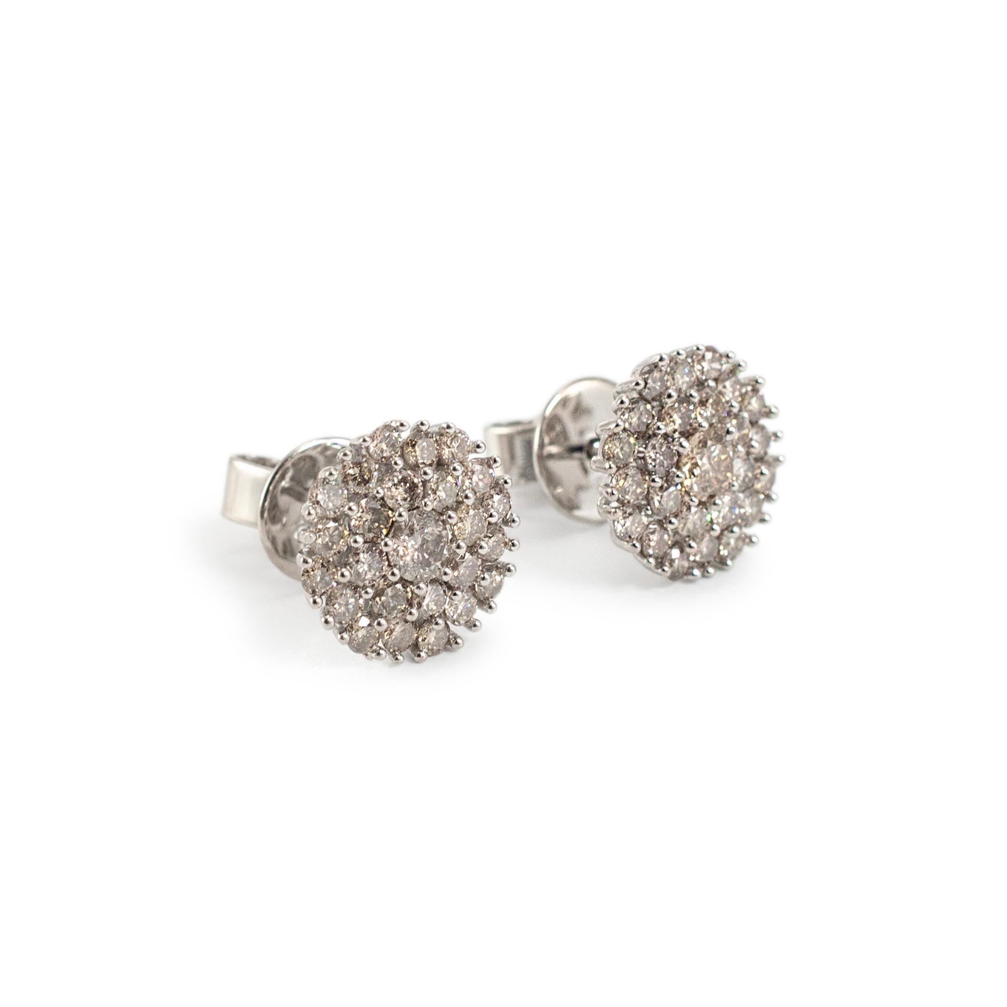 Metal Type: 18K White Gold

Diameter: 9.50 mm

Weight: 2.44 grams

18K white gold, diamond stud earrings with push-backs. The metal was tested and determined to be 18K white gold. Engraved with 