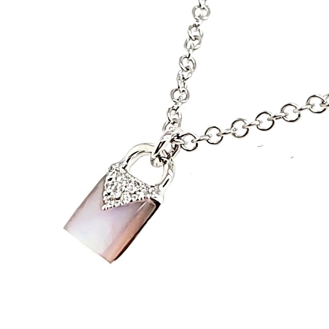 Unlock the beauty of love of this timeless piece.

Embellished with one lustrous freshwater pearl from Japan totaling 0.20 carats and adorned with pave round diamonds.

This exquisite piece is crafted in radiant 18K white gold, weighing 1.72 grams,