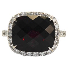 Bague en or blanc 18K grenat et diamant 7g