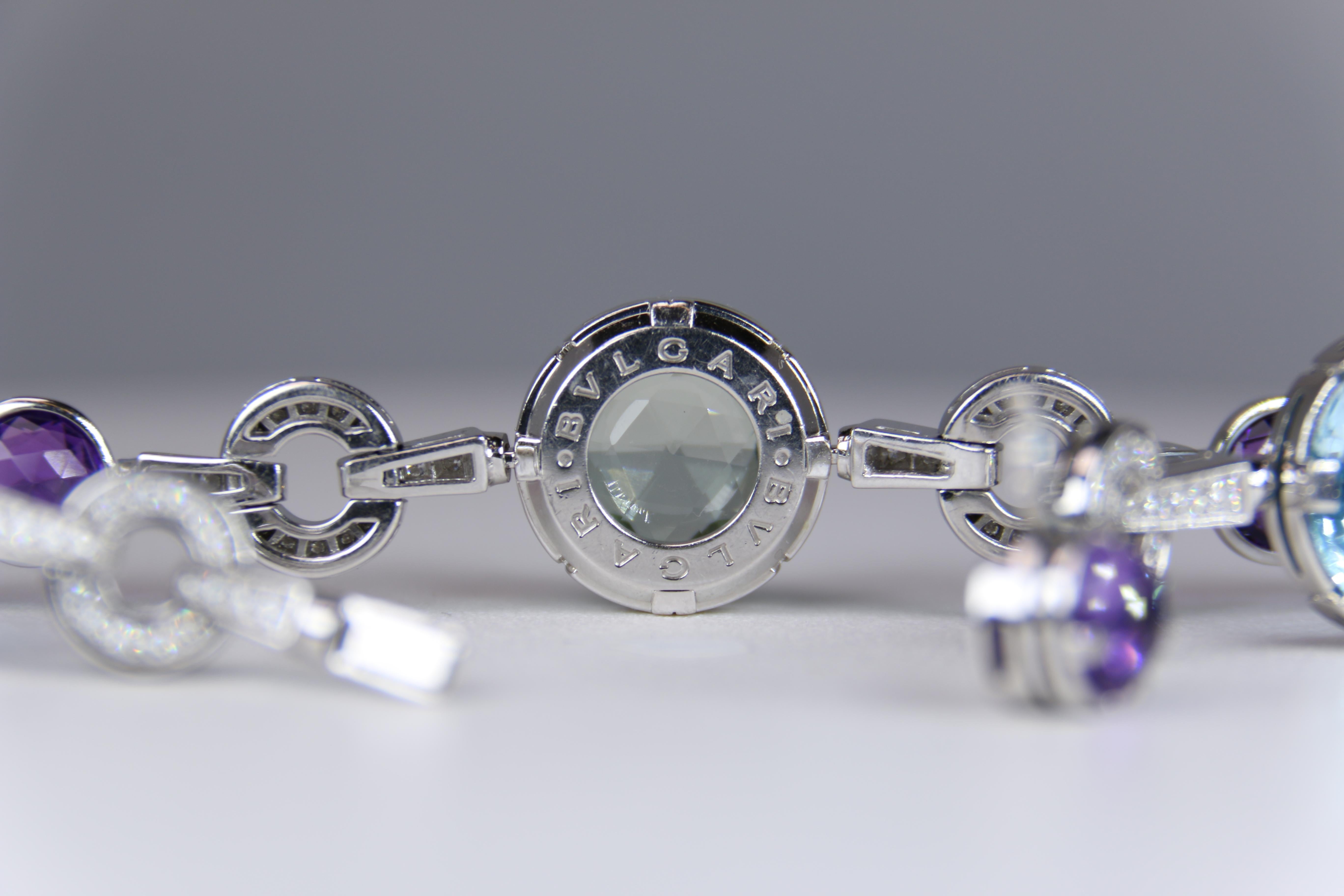 o	From Bulgari's vibrant Parentesi collection this 7.25 inch long bracelet is crafted in 18k white  gold and set with a variety of lens cut faceted round-shaped quartz and topaz gemstones including rich amythest and soft blue topaz that is