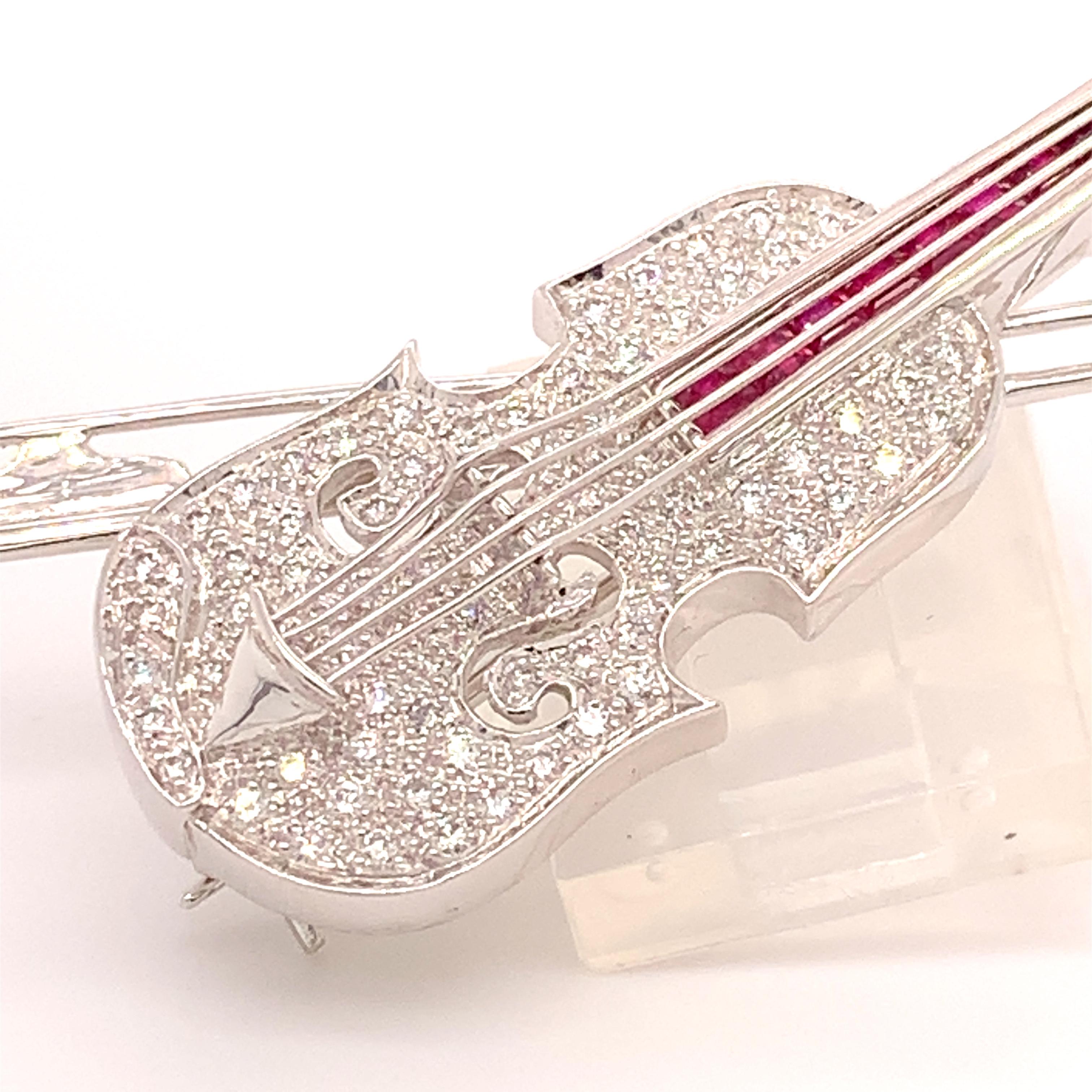 18k White Gold Genuine Natural Diamond and Ruby Violin Viola Brooch Pin (#J4846)

18k white gold violin/viola pin with over 1/2 carat total weight in pave set diamonds and almost 3/4 carat total weight in genuine rubies (in the neck under the