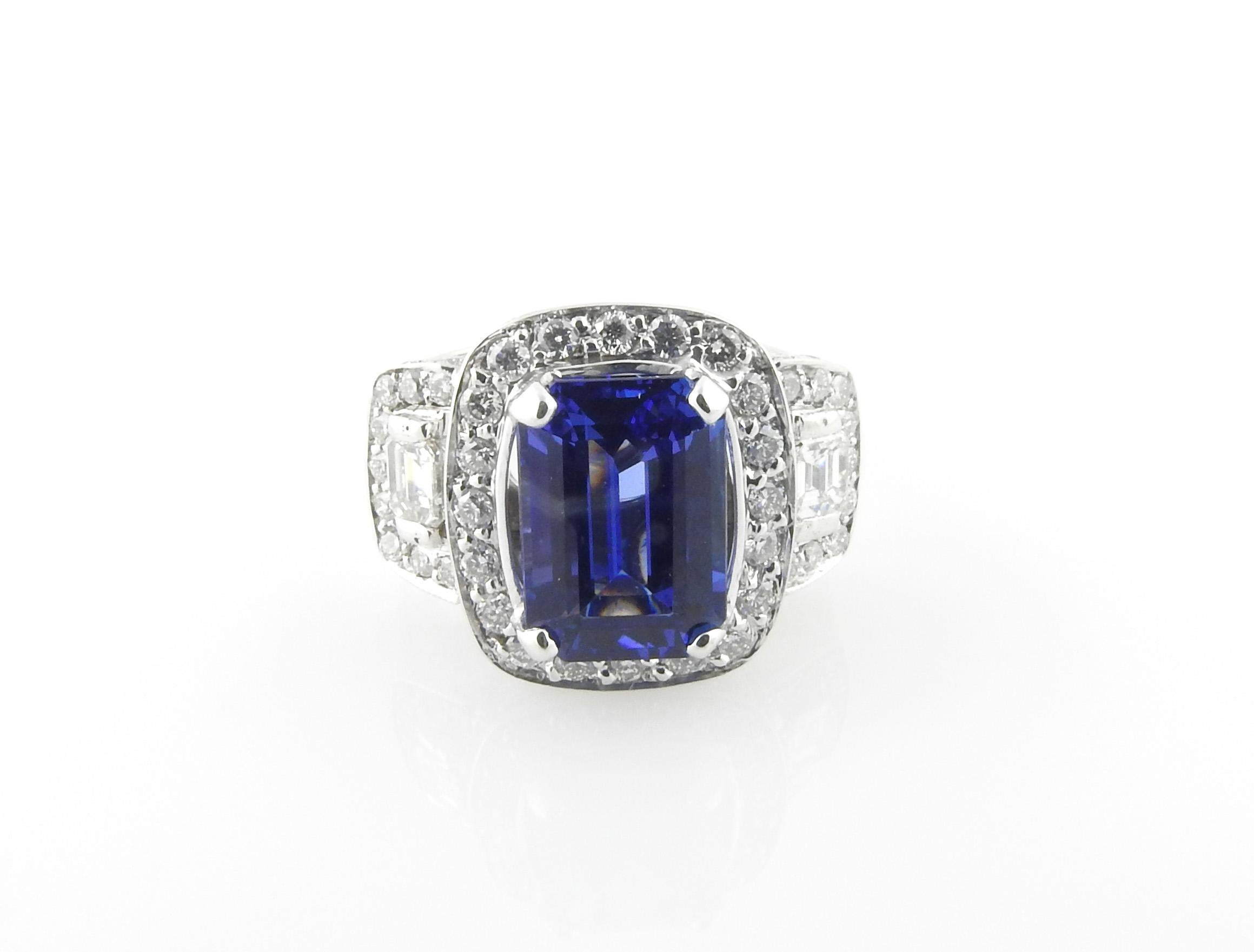 GAI certified 18K White Gold Genuine Tanzanite and Diamond Ring

This statement piece is set in white gold and has a genuine emerald cut blue tanzanite stone measuring at 4.14ct, with a AAA clarity grade.

The stunning tanzanite is blue with purple