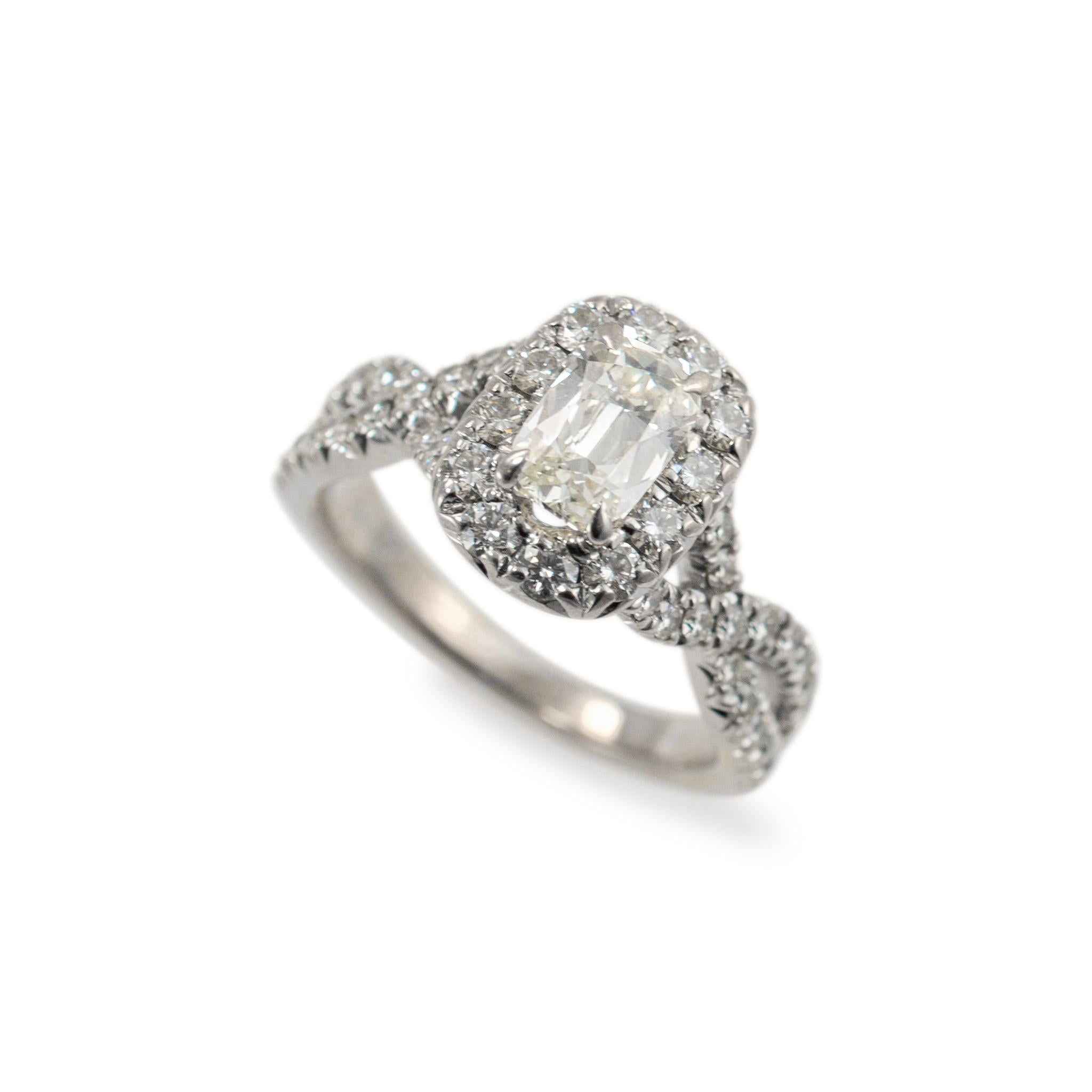  Gender: Ladies 

Metal Type: 18K White Gold

Ring Size: 6.5 

Weight: 6.45 grams

One ladies 18K white gold diamond engagement accented ring with a half-round shank. The metal was tested and determined to be 18K white gold. Engraved with 