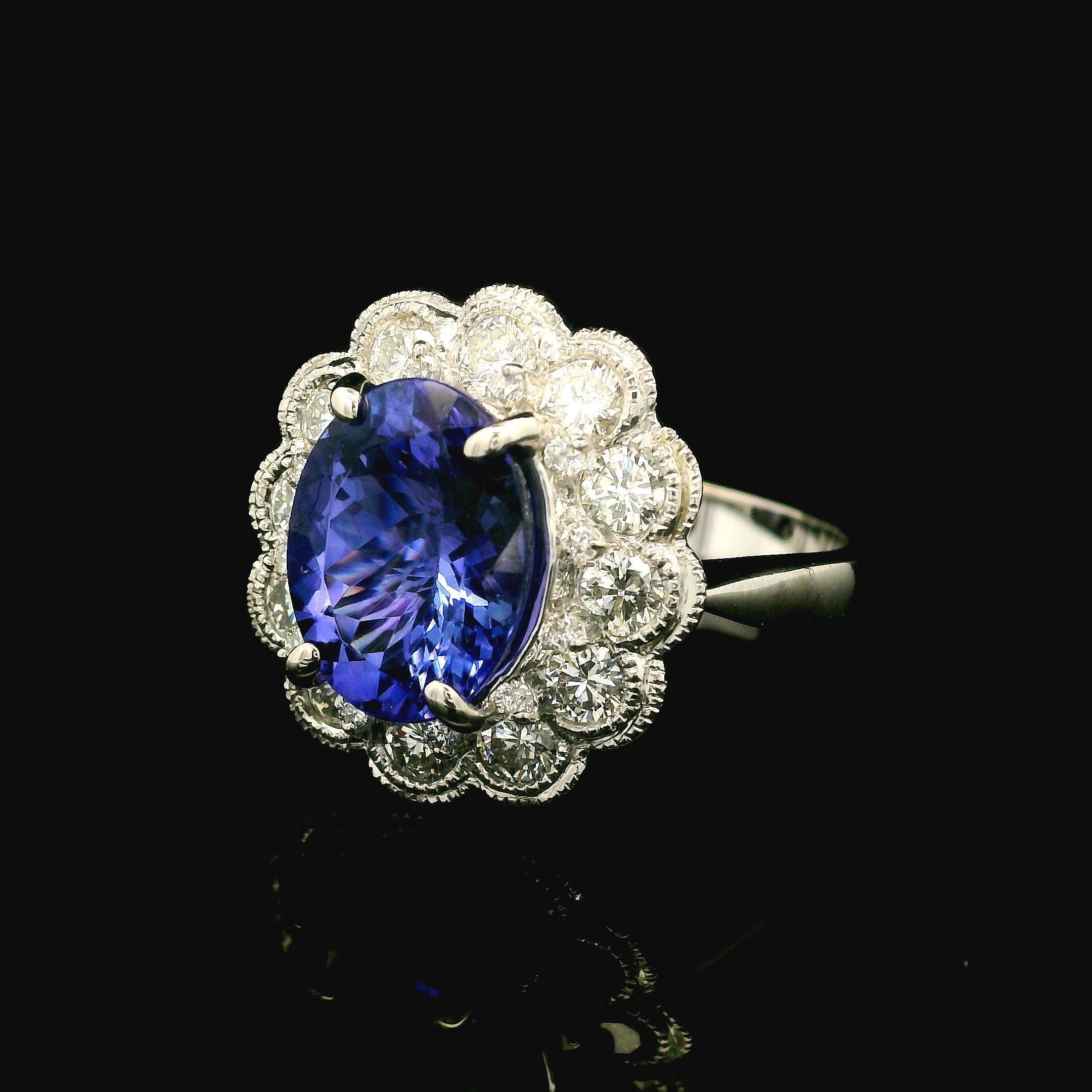--Stone(s):--
(1) Natural Genuine Tanzanite - Oval Cut - Prong Set - Bluish Violet Color - 3.29ct (approx. based on the certification measurements)
** See Certification Details Below for Complete Info **
(12) Natural Genuine Diamonds - Round