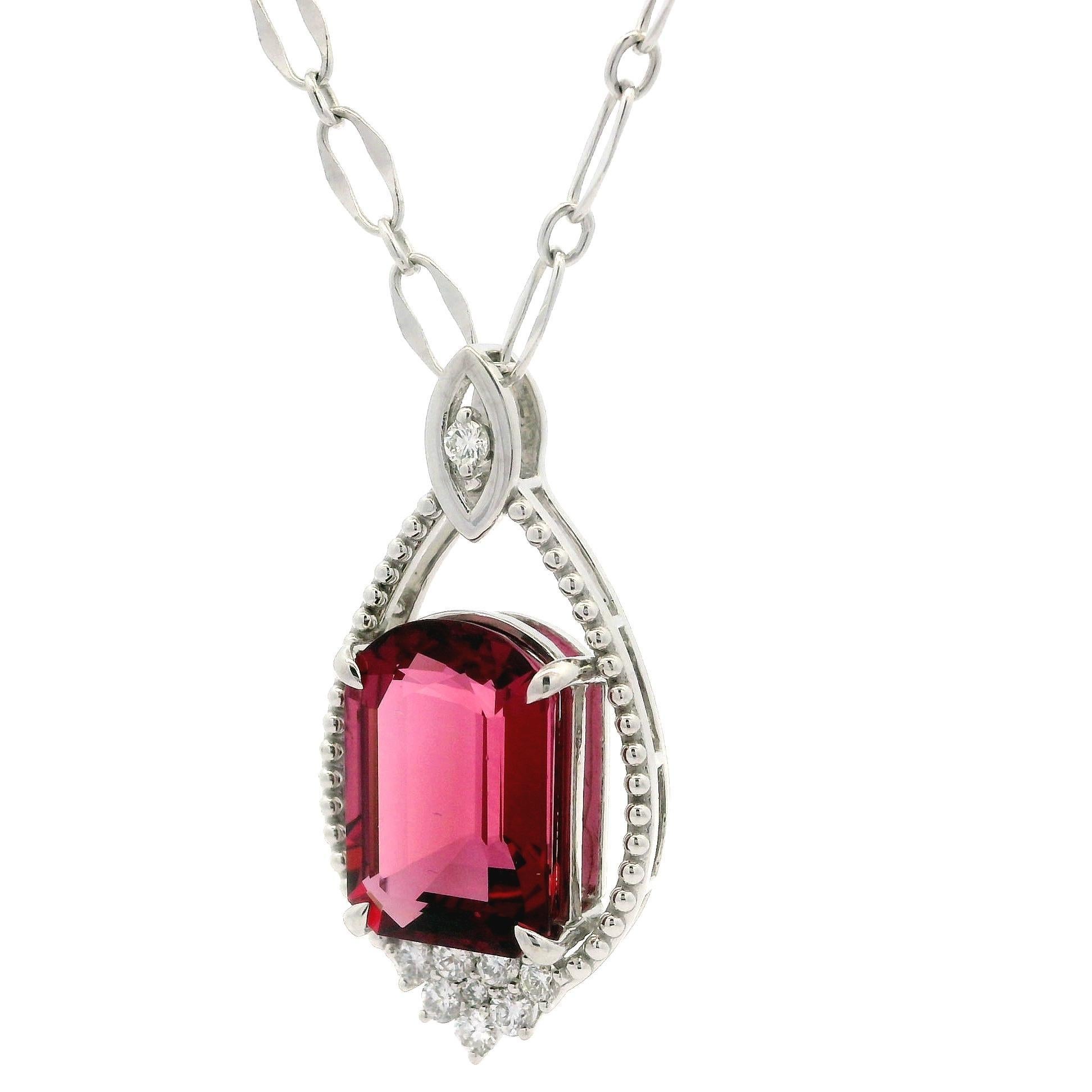 --Stone(s):--
(1) Natural Genuine Rubellite Tourmaline - Unique cut - Vivid Purplish Pink Color - 7.82 (exact )
** See Certification Details Below for Complete Info **
(9) Natural Genuine Diamonds - Round Brilliant Cut - Prong Set - Nice Brilliant
